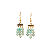 Pair of black and white zebra pattern earrings with gold accents on a white background