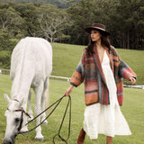 Harvest Slouch Cardigan worn with white midi dress, traveller boots and panama hat.