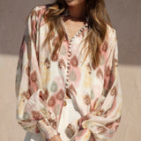 Isla Blouse Mauve Paisley features long billowy sleeves, shirred cuffs and button down style