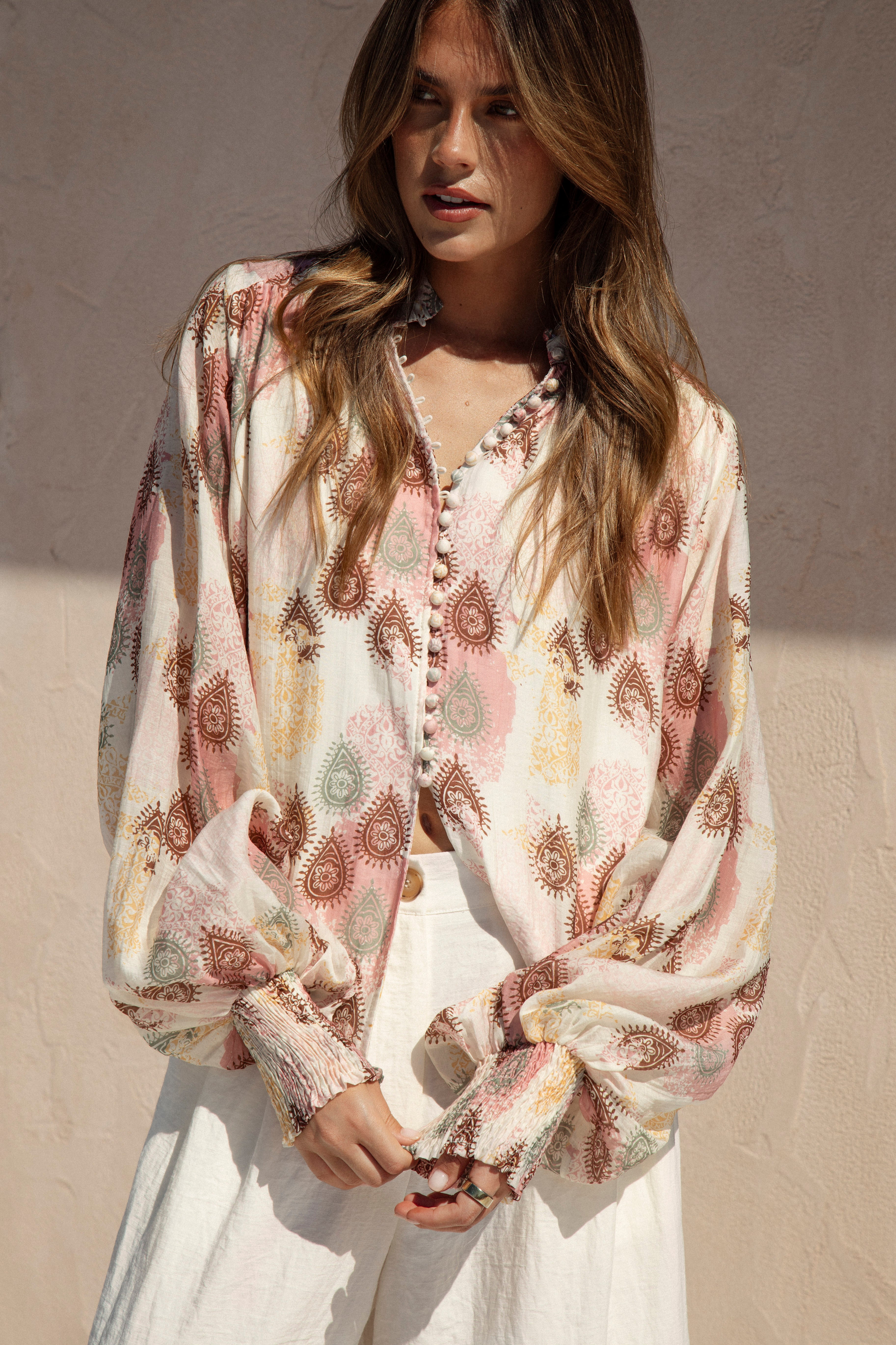 Isla Blouse Mauve Paisley features long billowy sleeves, shirred cuffs and button down style
