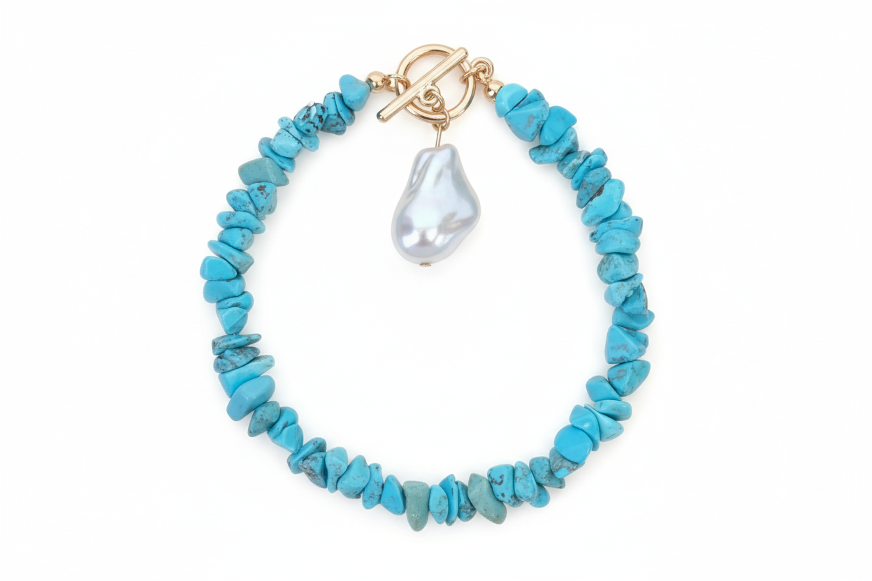 Turquoise beaded bracelet with a pearl pendant on a white background
