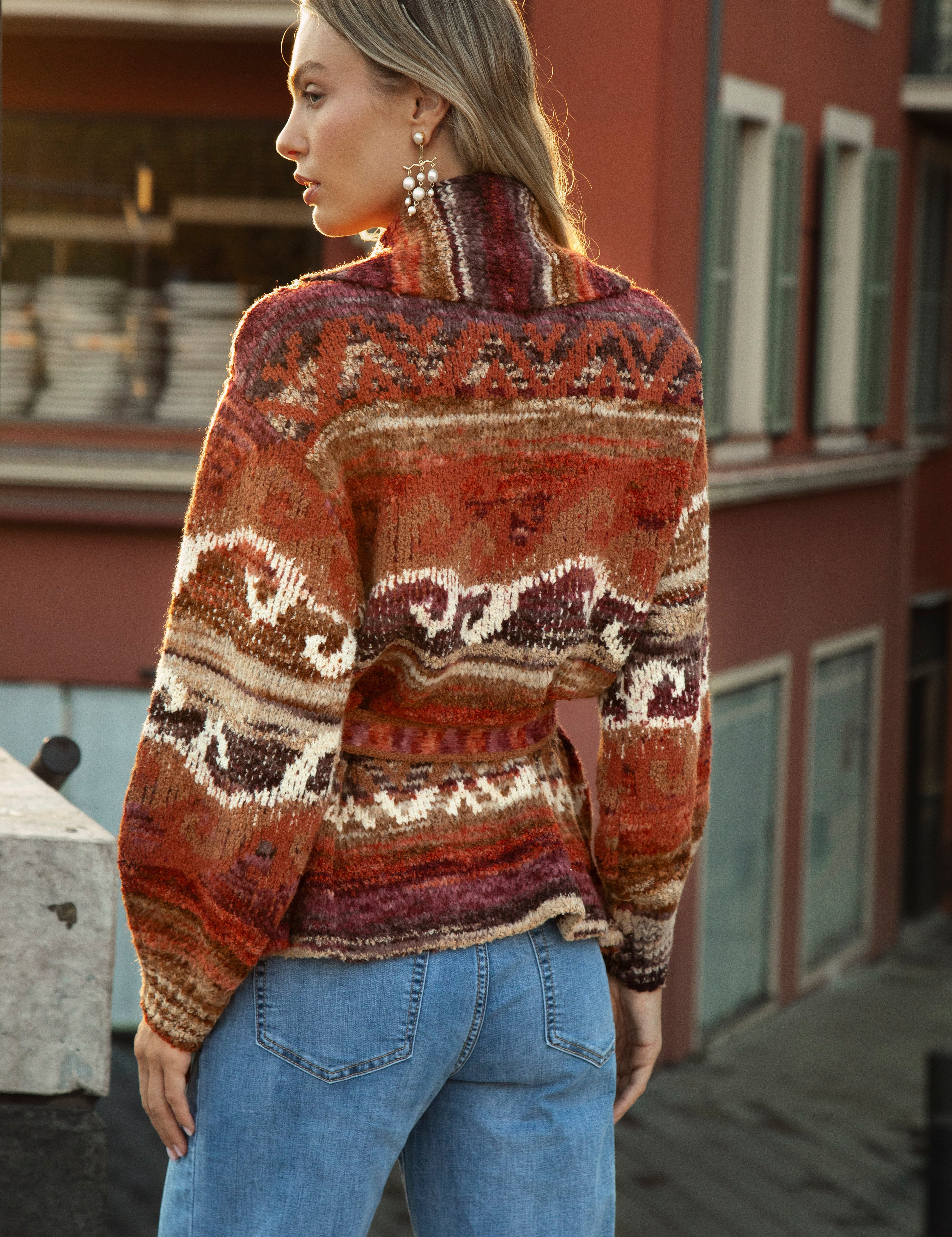Kasbah Belted Cardigan - rear view showcasing geometric pattern in shades or rust, orange, burgundy, brown and cream