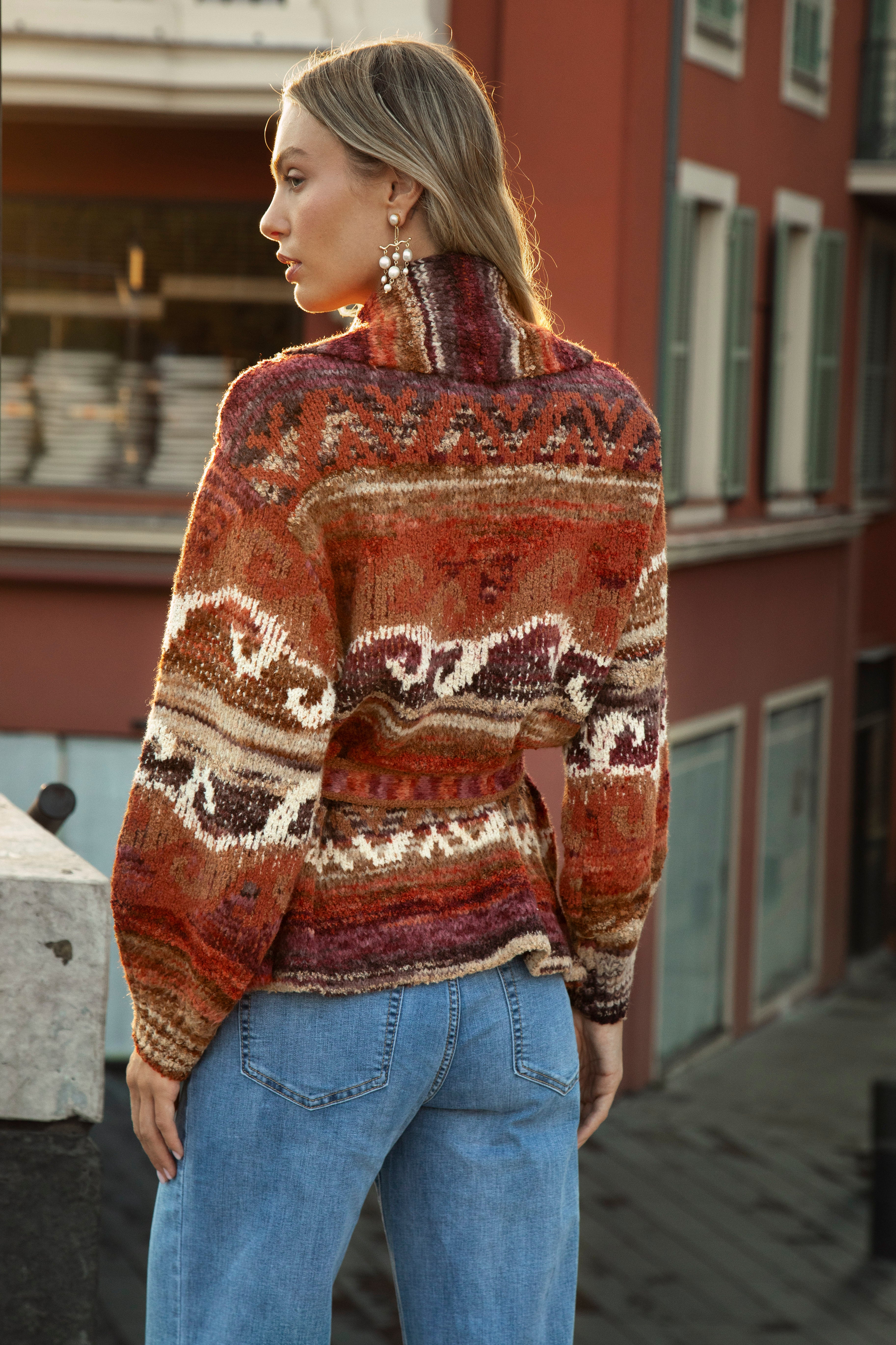 Kasbah Belted Cardigan - rear view showcasing geometric pattern in shades or rust, orange, burgundy, brown and cream