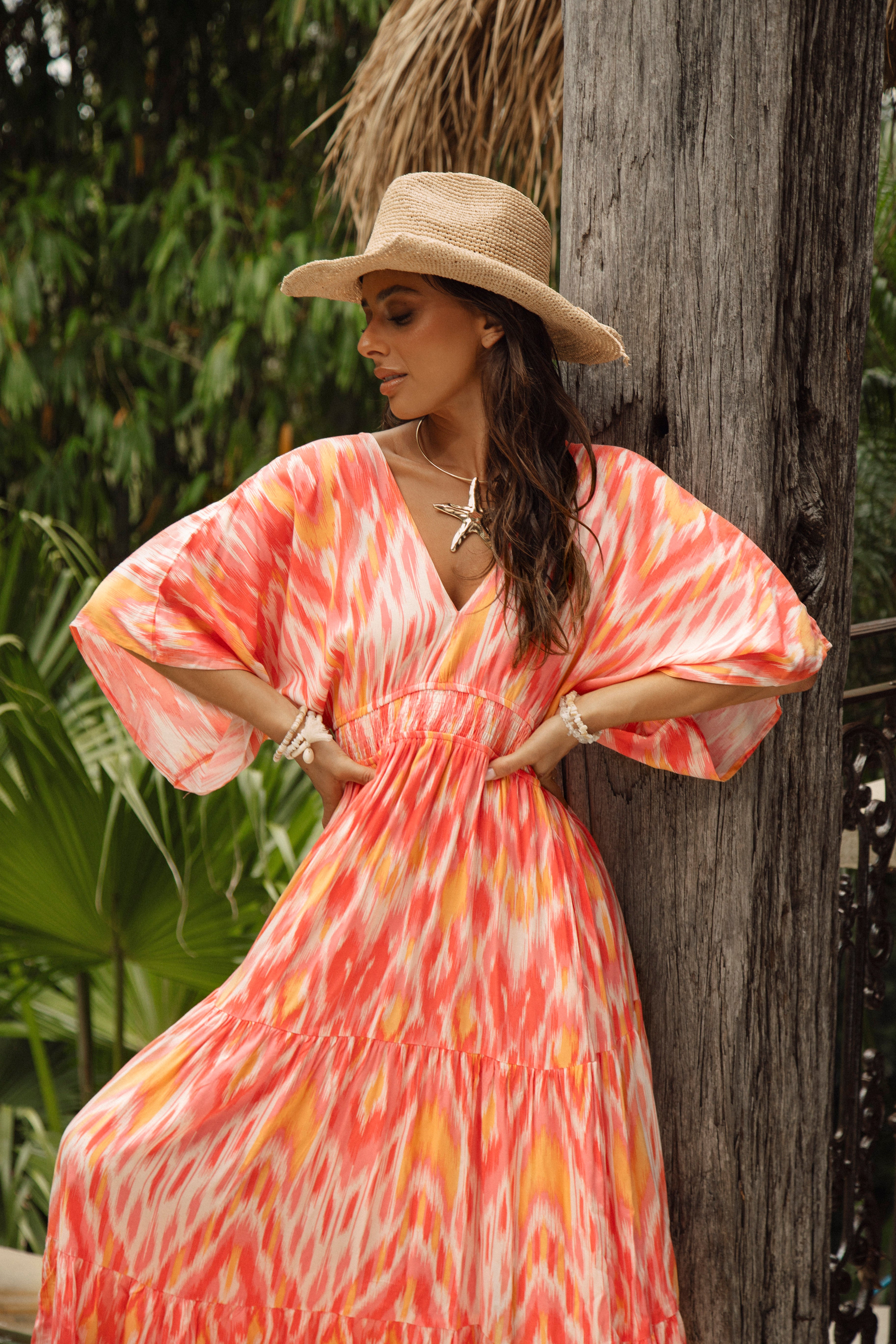 Lani Maxi Dress Sunburst is a Boho style maxi with billowy sleeves in vibrant orange and yellow colourway