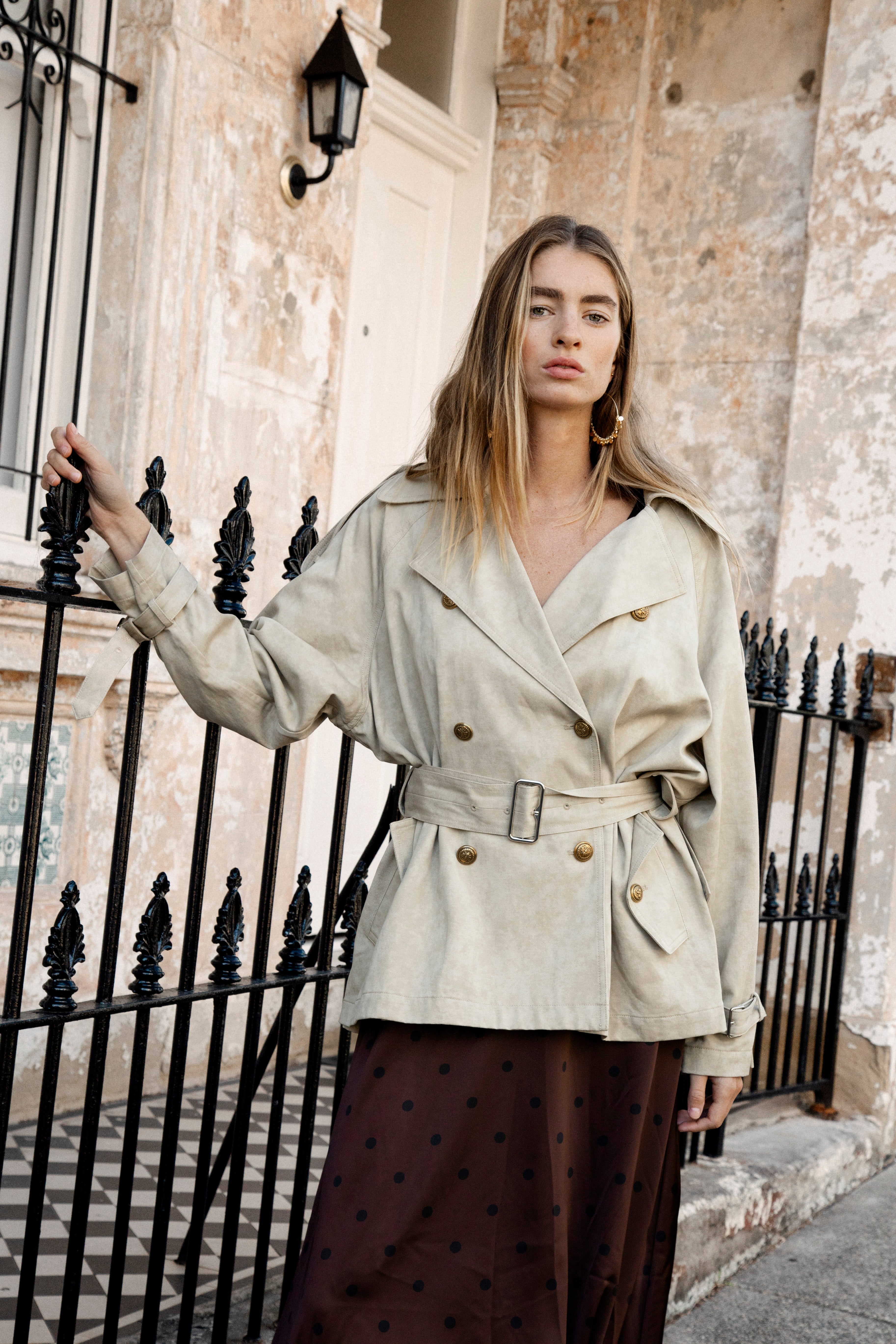 Lumae Trench Coat featuring wide lapes, double breasted style, fabric belt closure and stone colourway