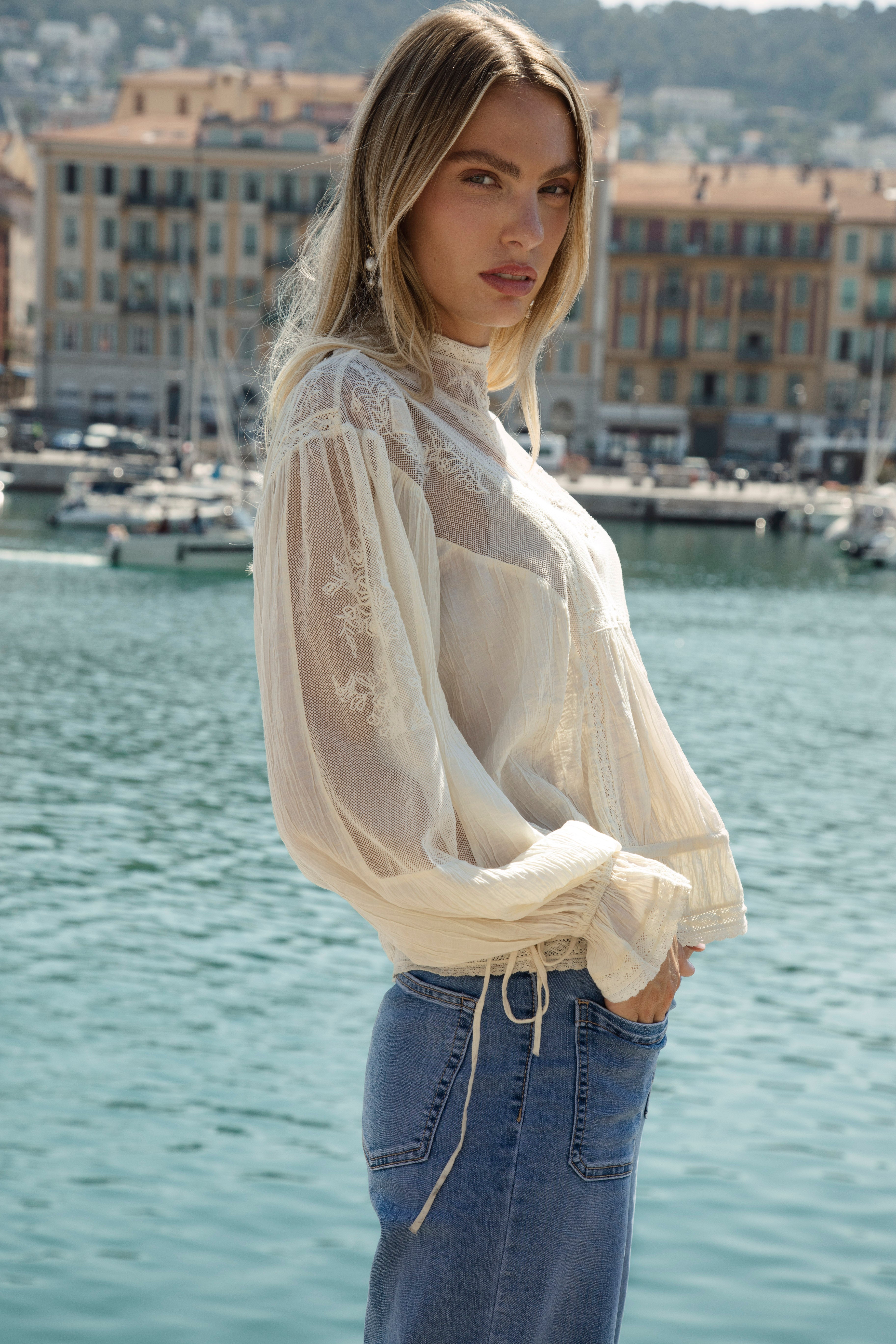 Lumiere Blouse - side view showcasing ruffle at cuffs and lace sleeves