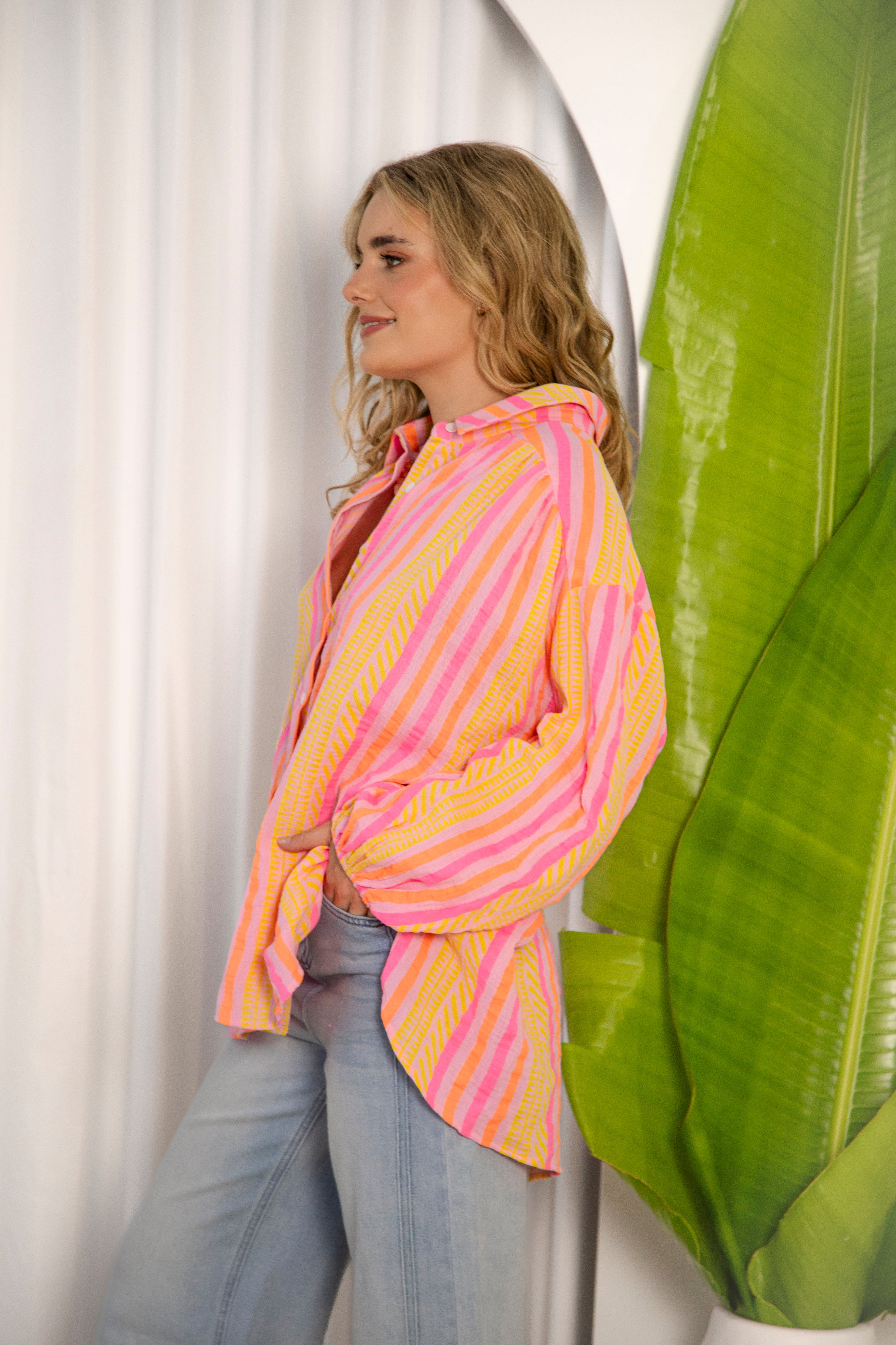 Maddison Stripe Shirt is a colourful striped shirt in shades of pink, orange and yellow with oversized fit.