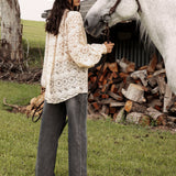 Margot Lace Blouse Macadamia. Rear view showcasing oversized style, billowy long sleeves and cream colourway.