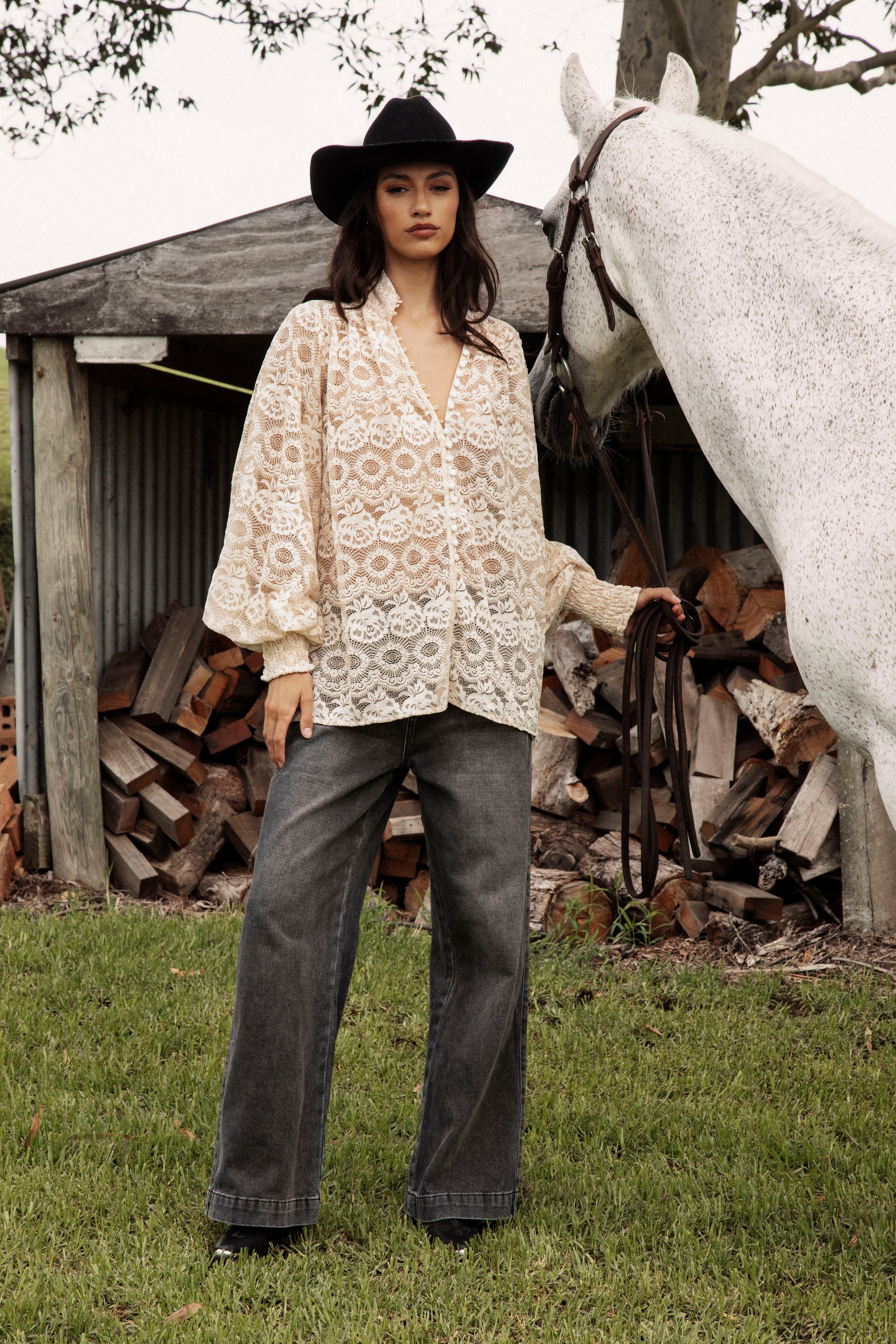 Margot Lace Blouse Macadamia showcasing button down style, stand collar, billowy cuffed sleeves.