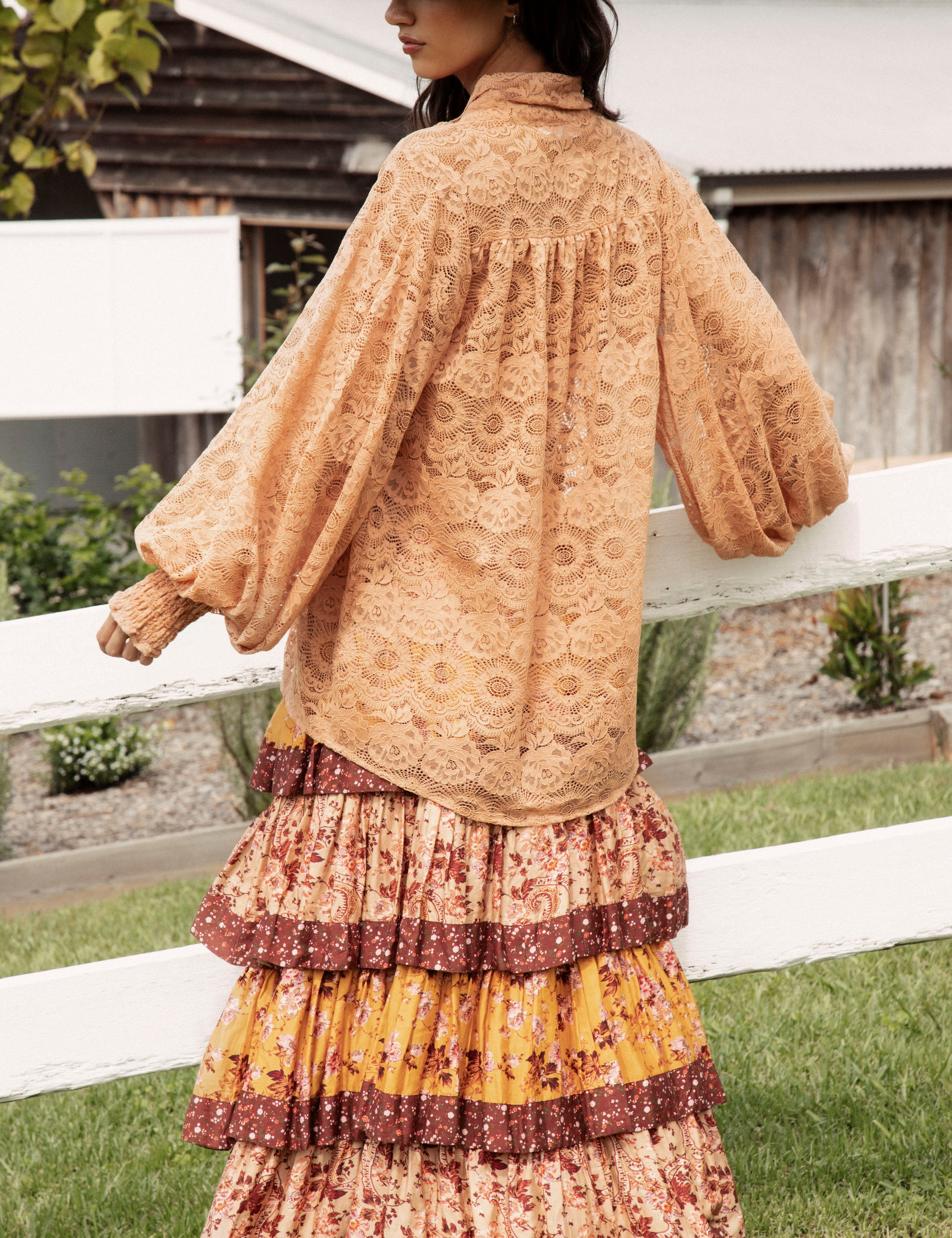 Margot Lace Blouse Terracotta. Rear view showcasing oversized fit, billowy style and lace fabric.
