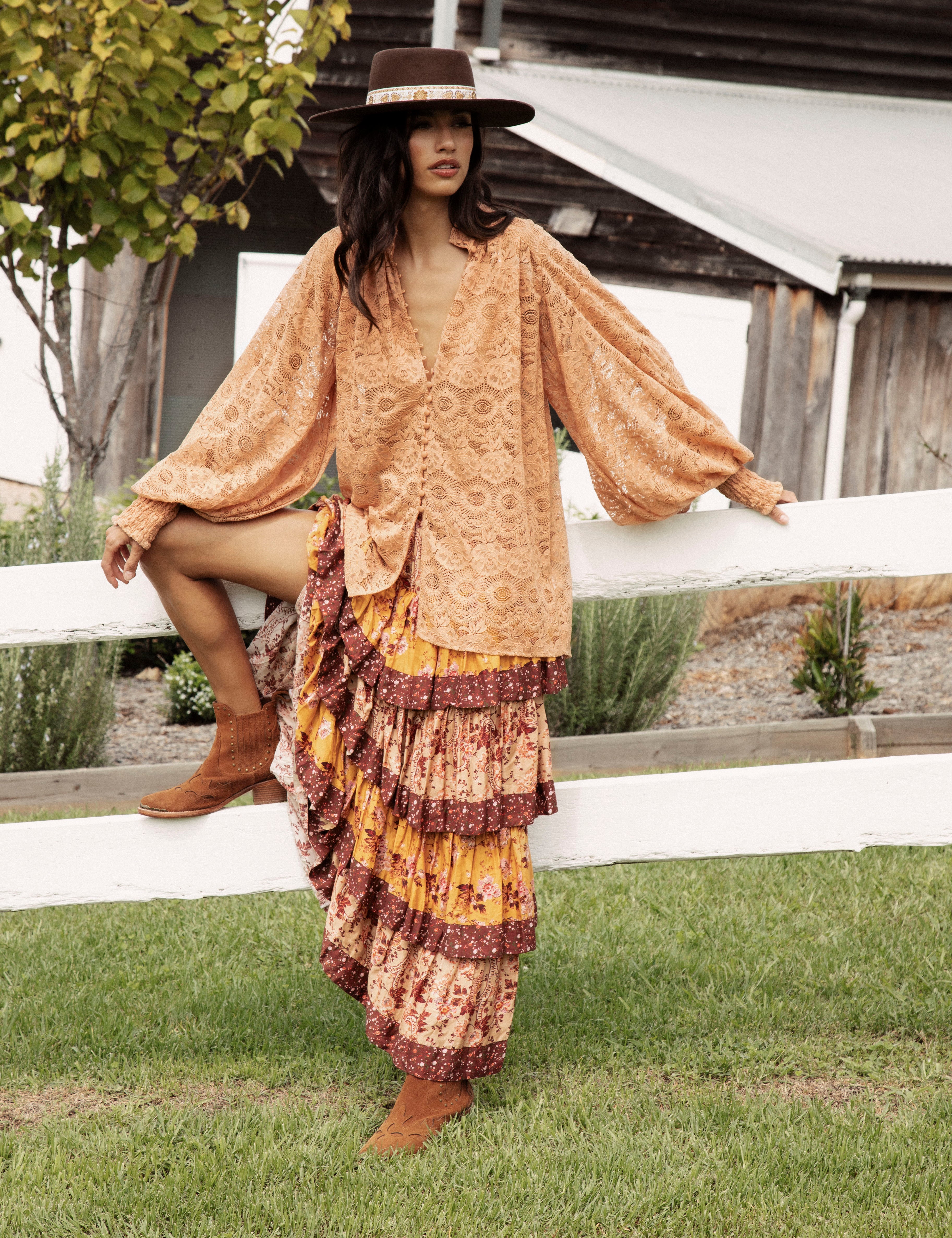 Margot Lace Blouse Terracotta showcasing button down style, stand collar, billowy sleeves and oversized fit.