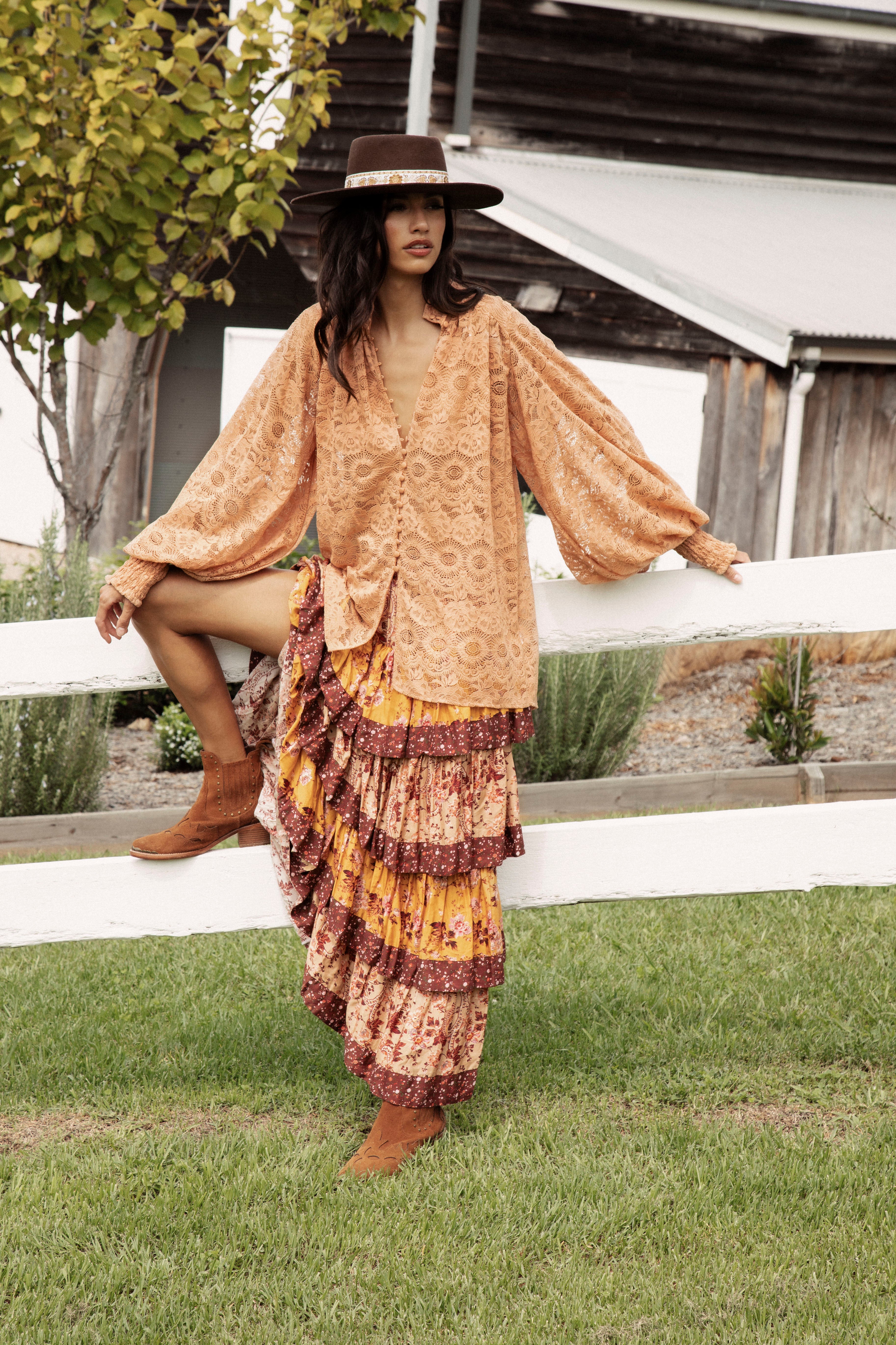 Margot Lace Blouse Terracotta showcasing button down style, stand collar, billowy sleeves and oversized fit.