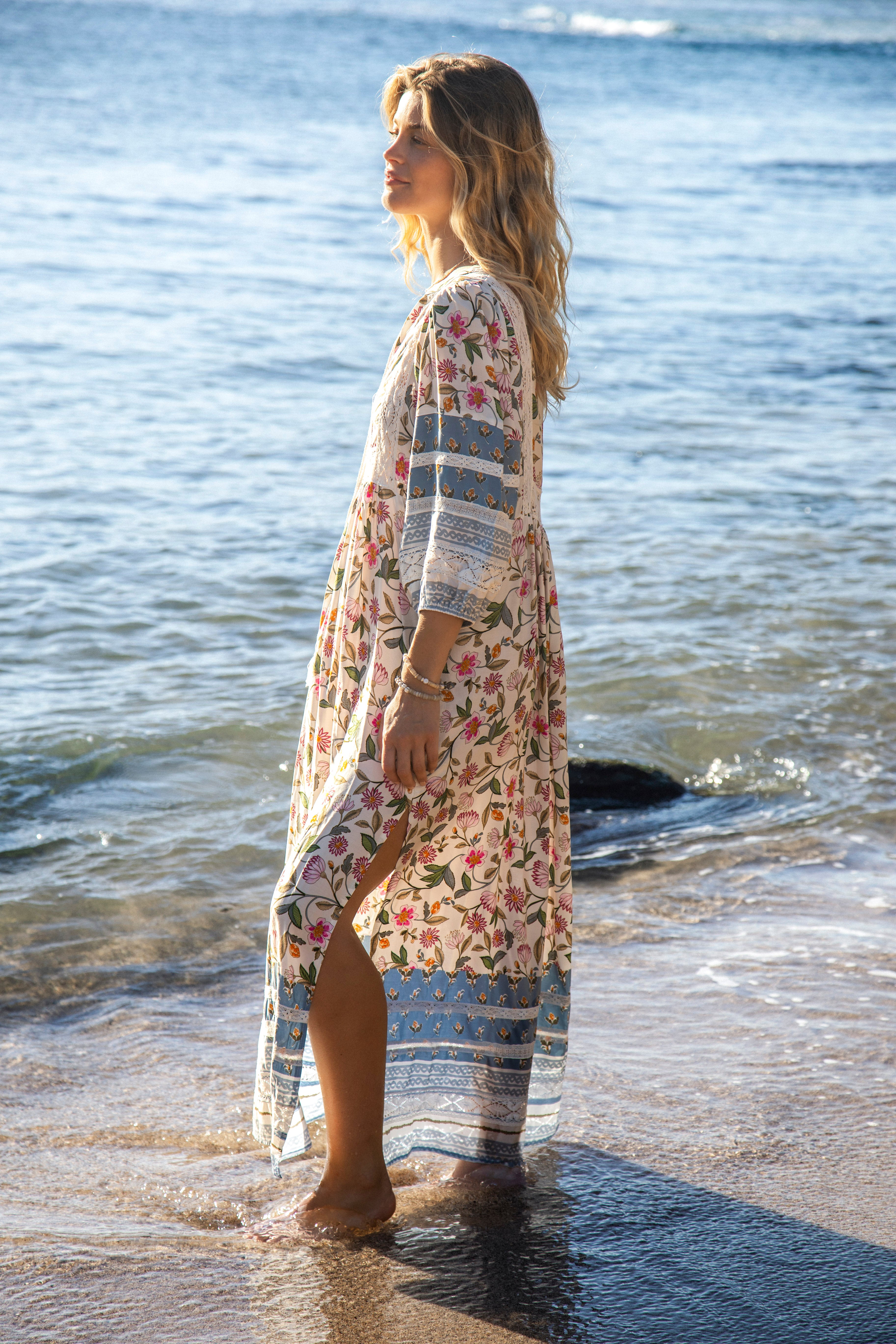 Meadow Maxi Dress Pixie Petals Side View showcasing side split in skirt and 3/4 length billowy sleeves