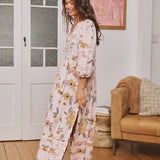 Meadow Maxi Valentina - Boho Maxi Dress. Side view showcasing side split and crochet detail at hem and sleeve