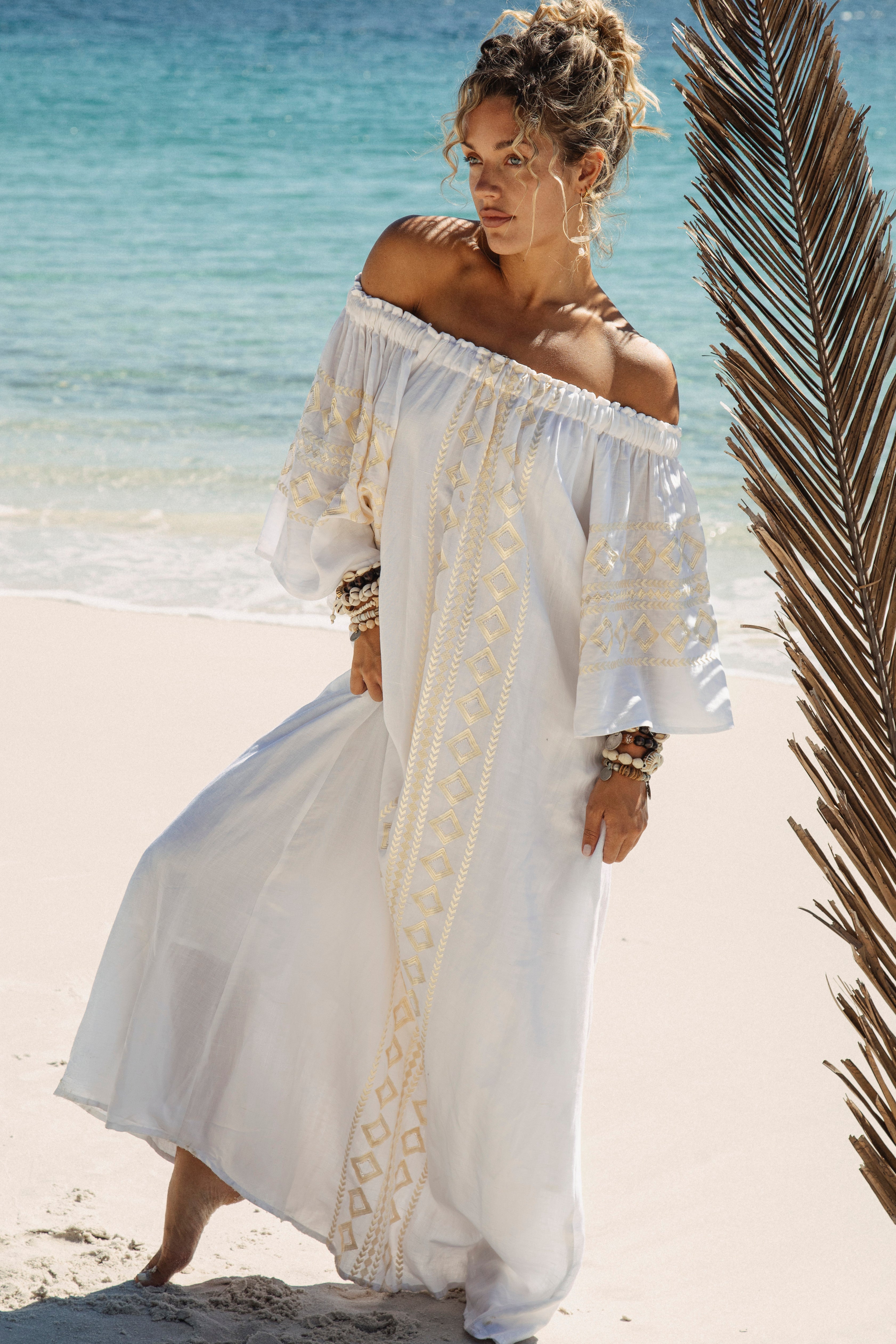 Odyssey Maxi Dress features off the shoulder style and generous fit