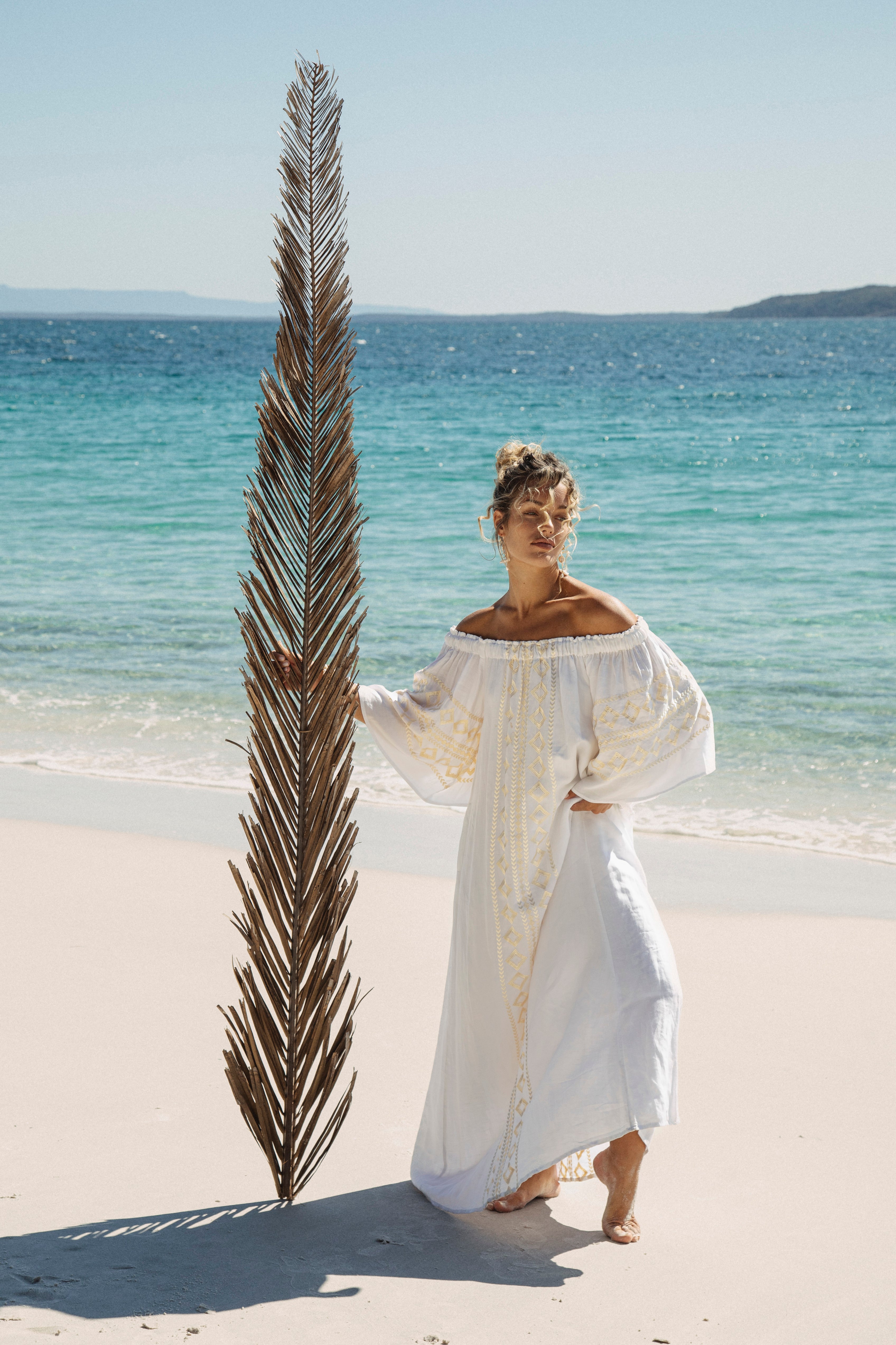 Odyssey Maxi Dress in white with gold embroidery at front, rear and sleeves