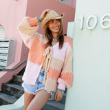 Pastel Bliss Cable Cardigan - soft oversized cardi in shades of peach and pink with statement white stitching.