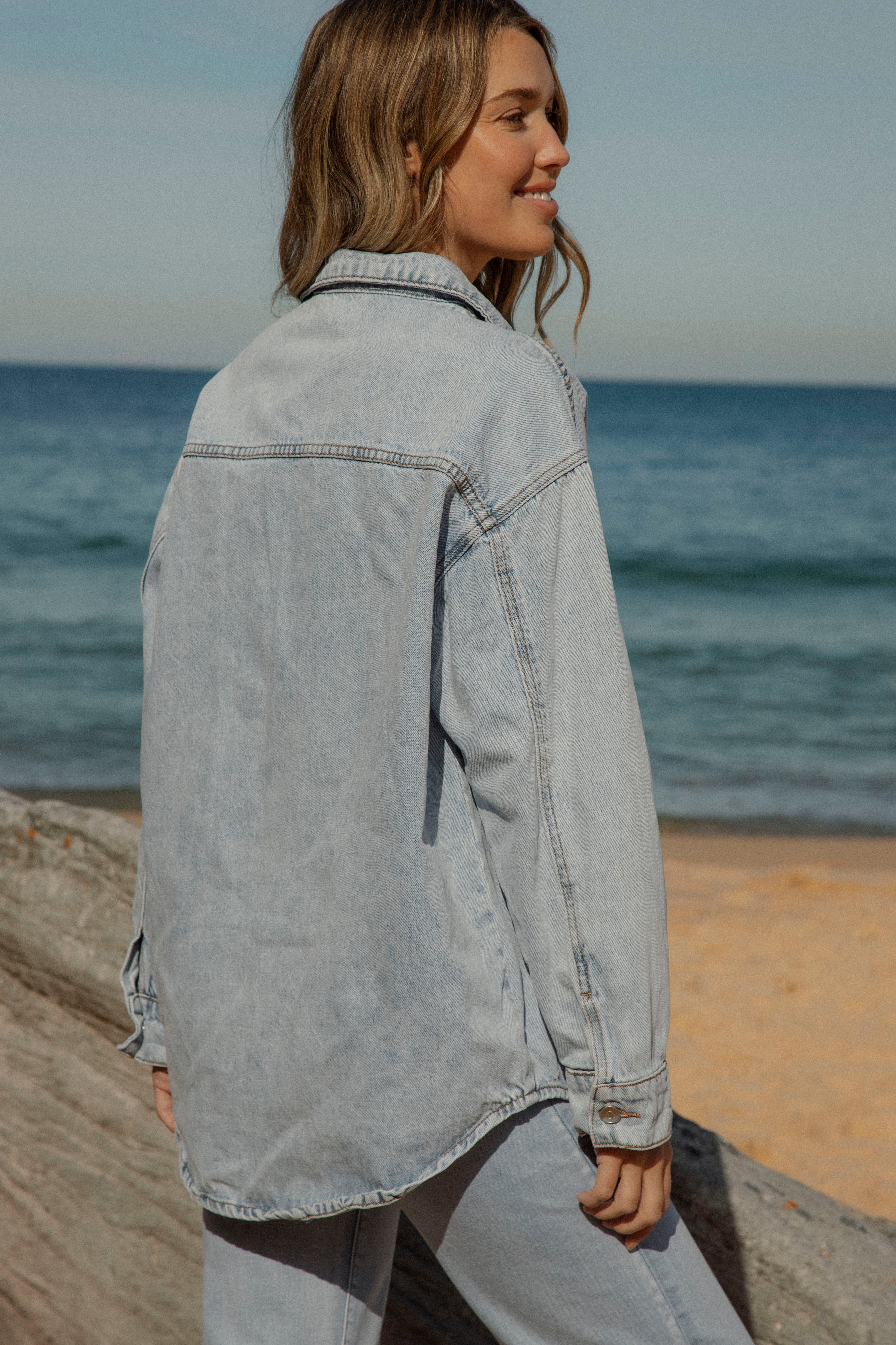 Raven Denim Shacket in lightwash denim. Rear View.