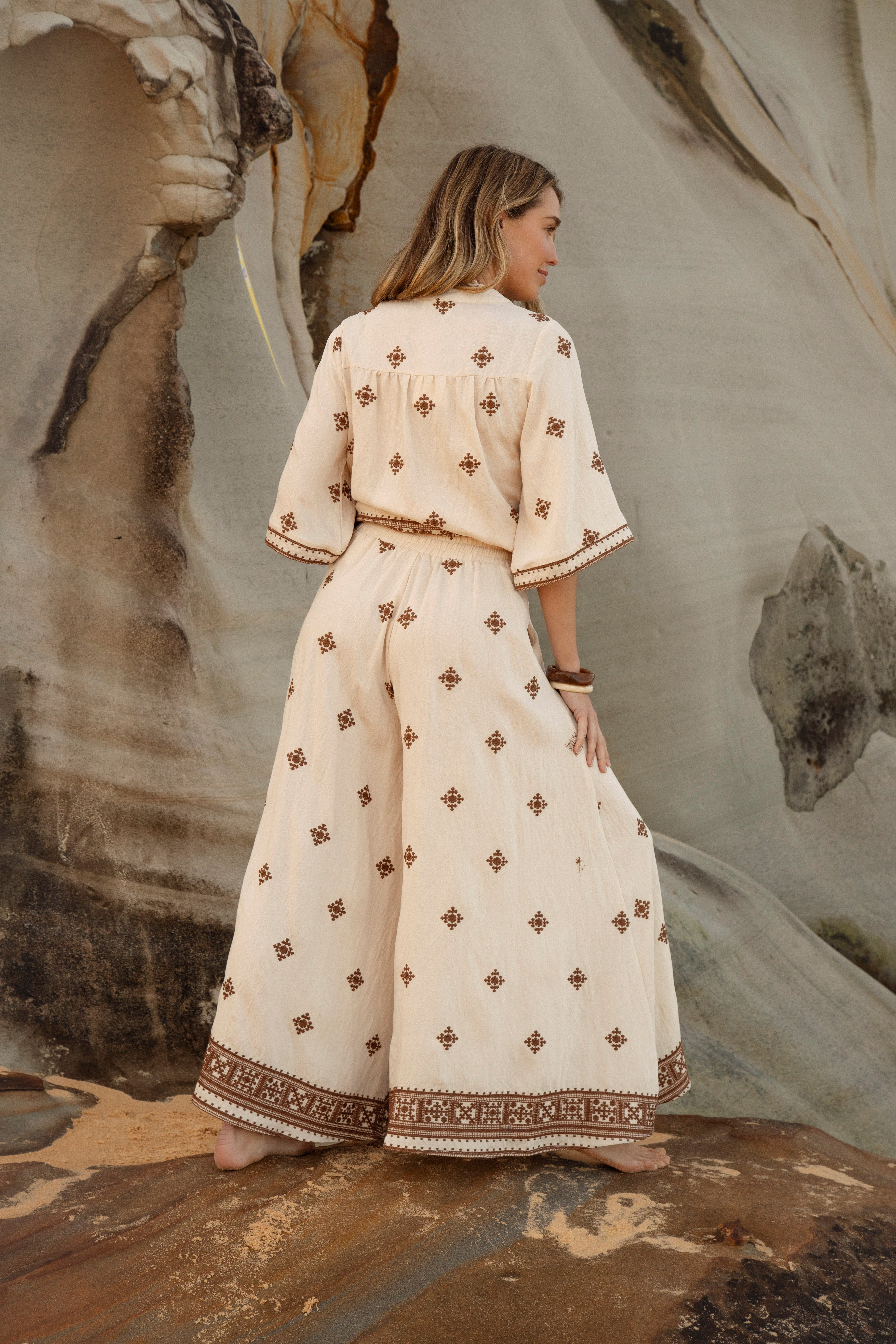 Kasbah Resort Pant is a wide leg pant in cream colourway featuring brown embroidered pattern in Boho style