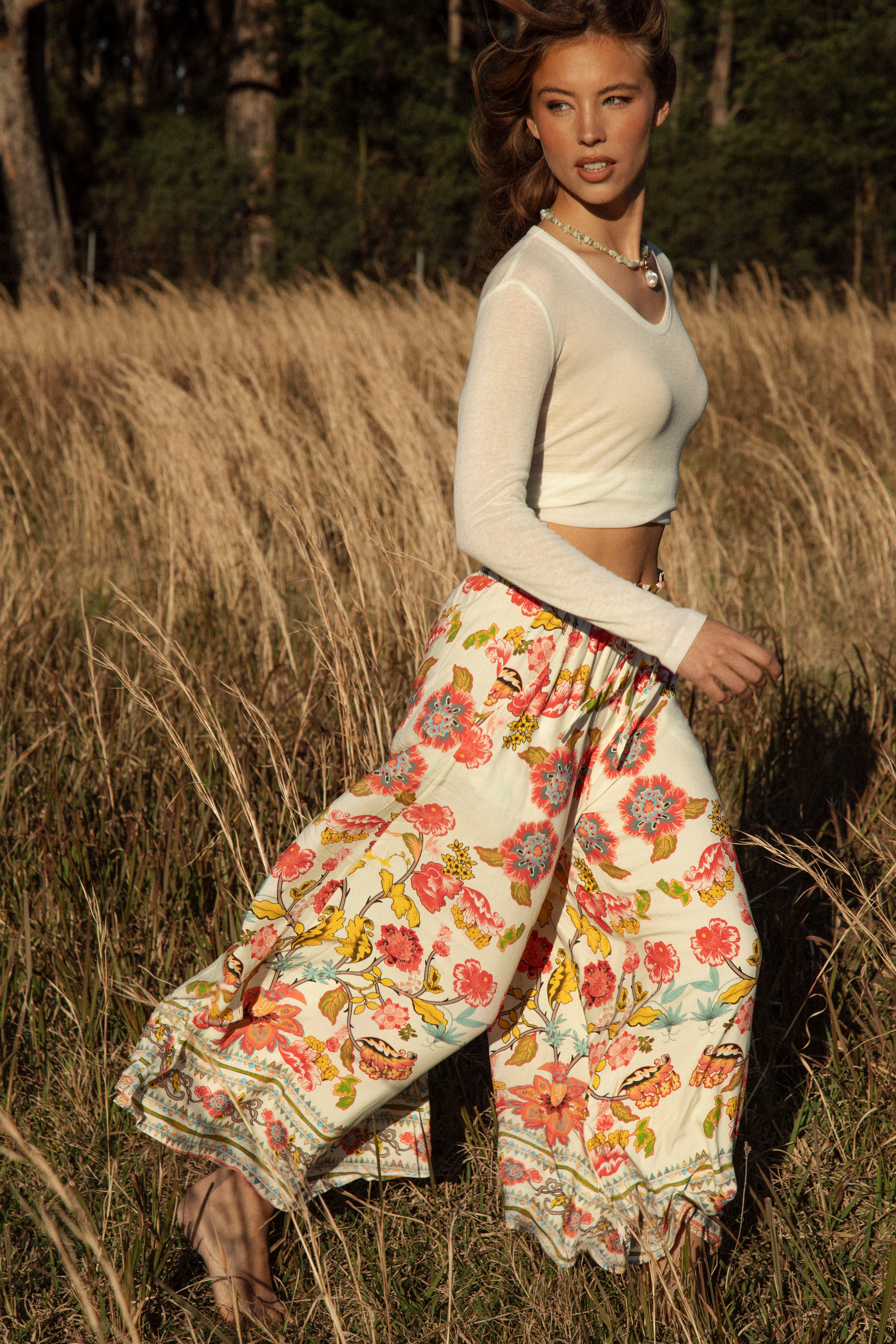 Resort Pant Golden Bloom - wide-leg white pant with colourful boho floral pattern and contrasting trim