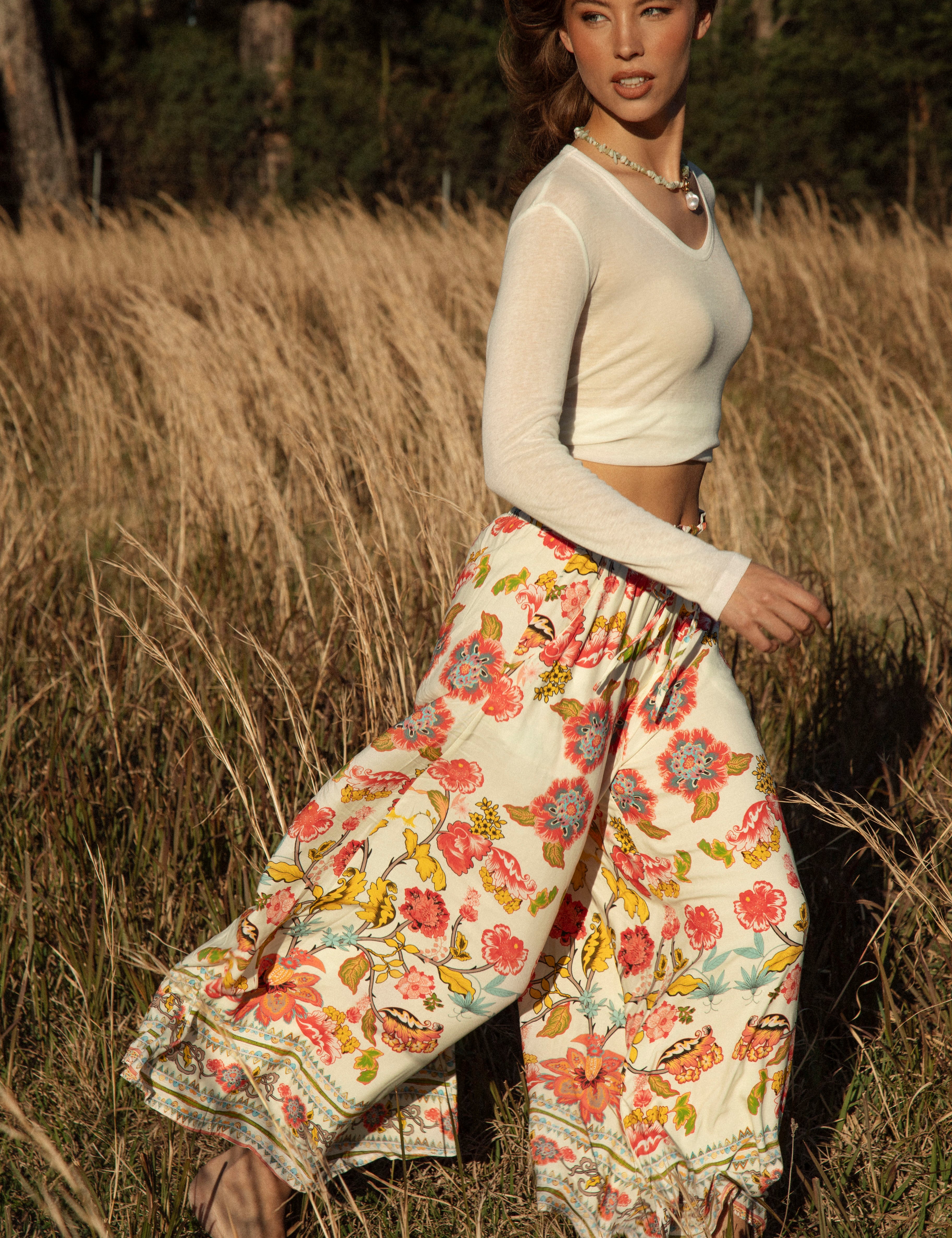 Resort Pant Golden Bloom - wide-leg white pant with colourful boho floral pattern and contrasting trim