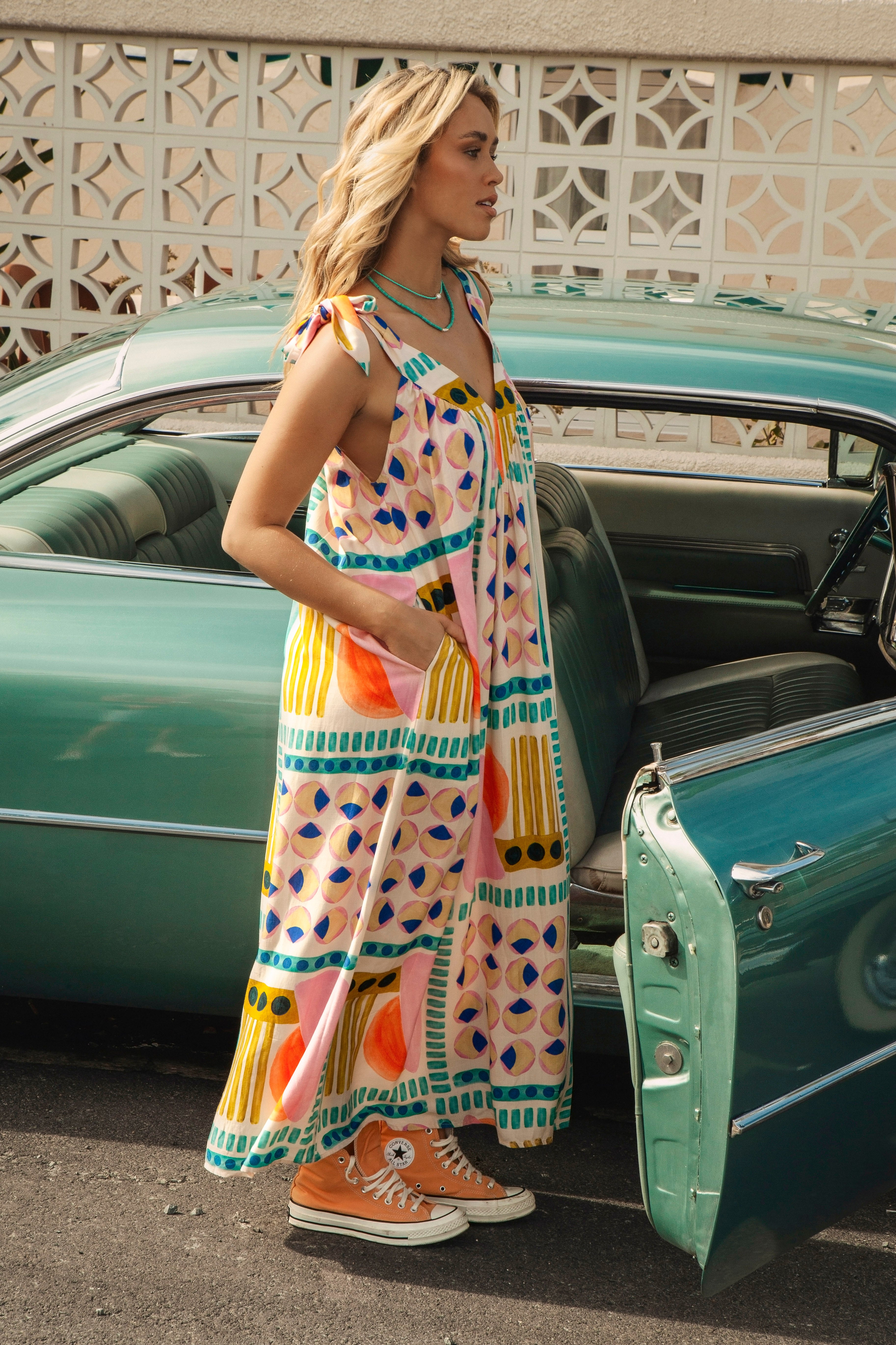 Retro Groove Maxi Dress features retro 80s style, pockets and tie closure at shoulders