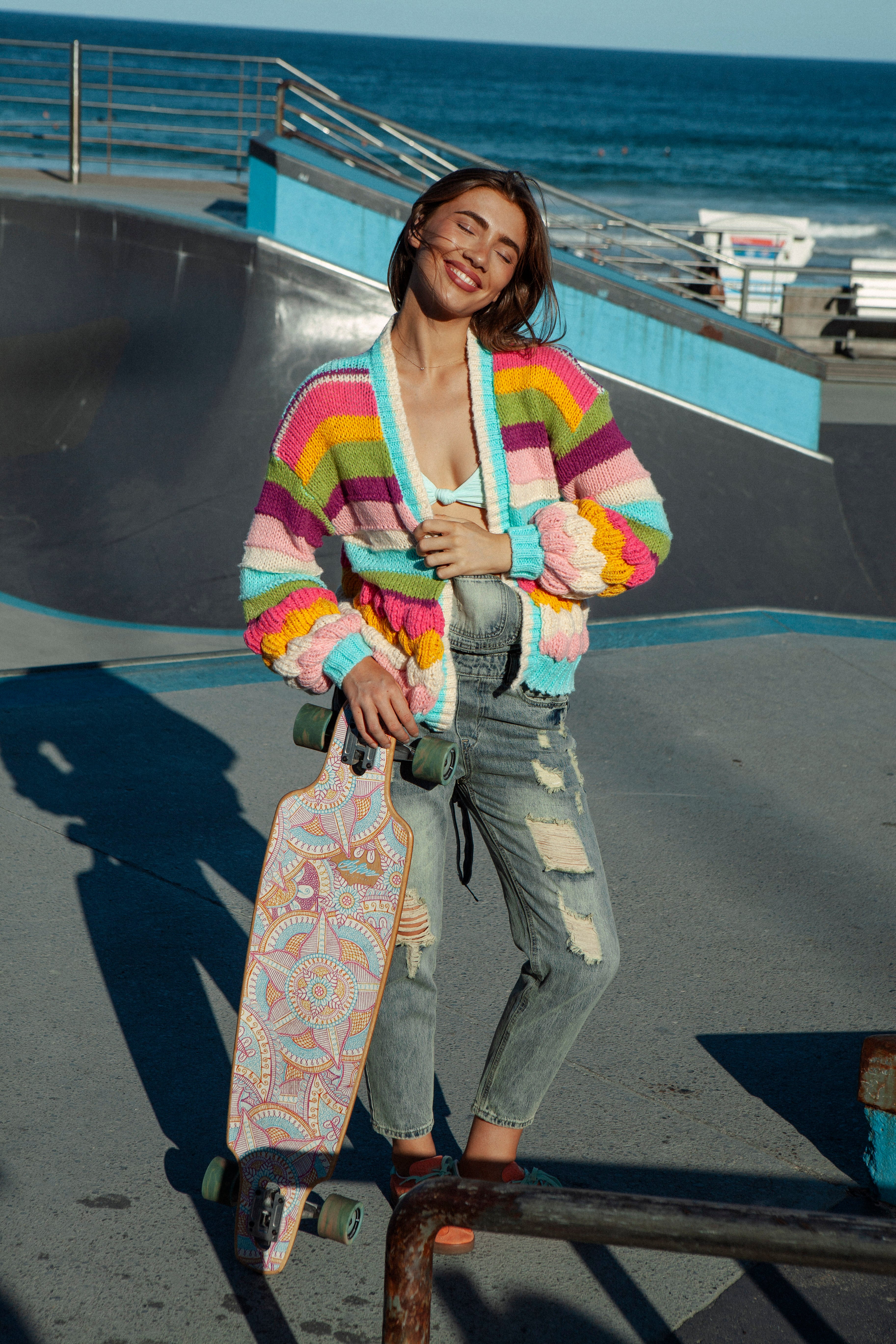 Retro Rainbow Stripe Cardigan featuring chunky style knit and bright coloured stripe pattern