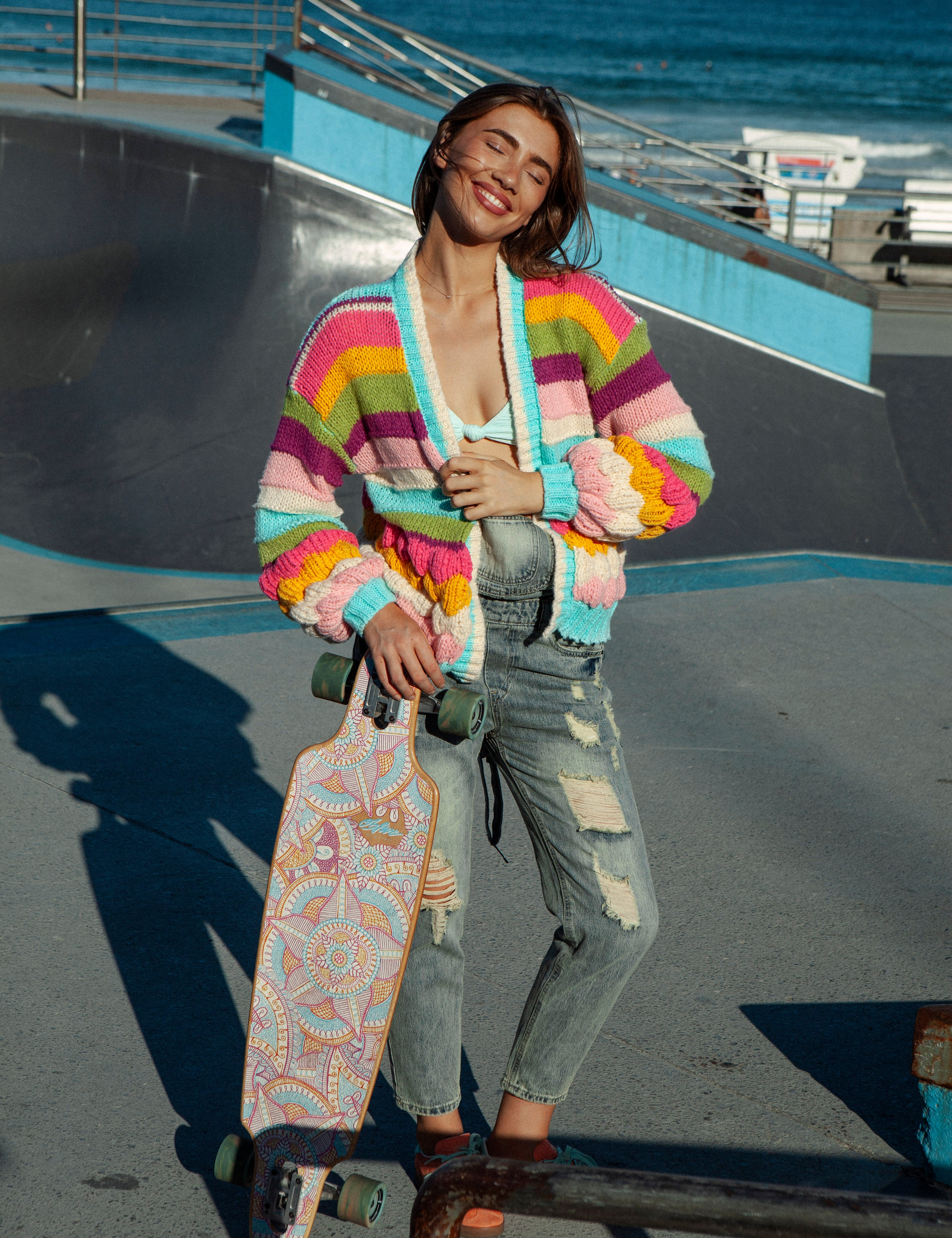 Retro Rainbow Stripe Cardigan featuring chunky style knit and bright coloured stripe pattern