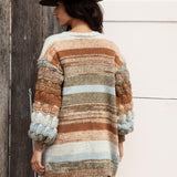 Riverbend Stripe Cardi is a longline cardigan featuring chunky knit at sleeves and an ombré striped pattern.