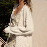 Romie Cable Cardigan Latte. Longline cardigan with statement pockets in neutral cream colourway.