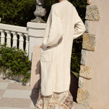 Romie Cable Cardigan Latte - rear view showcasing longline style, oversized fit and slight cable knit.