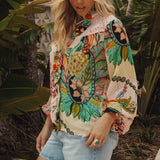 Rosé Blouse showcasing floral print and long sleeves with elasticised cuff