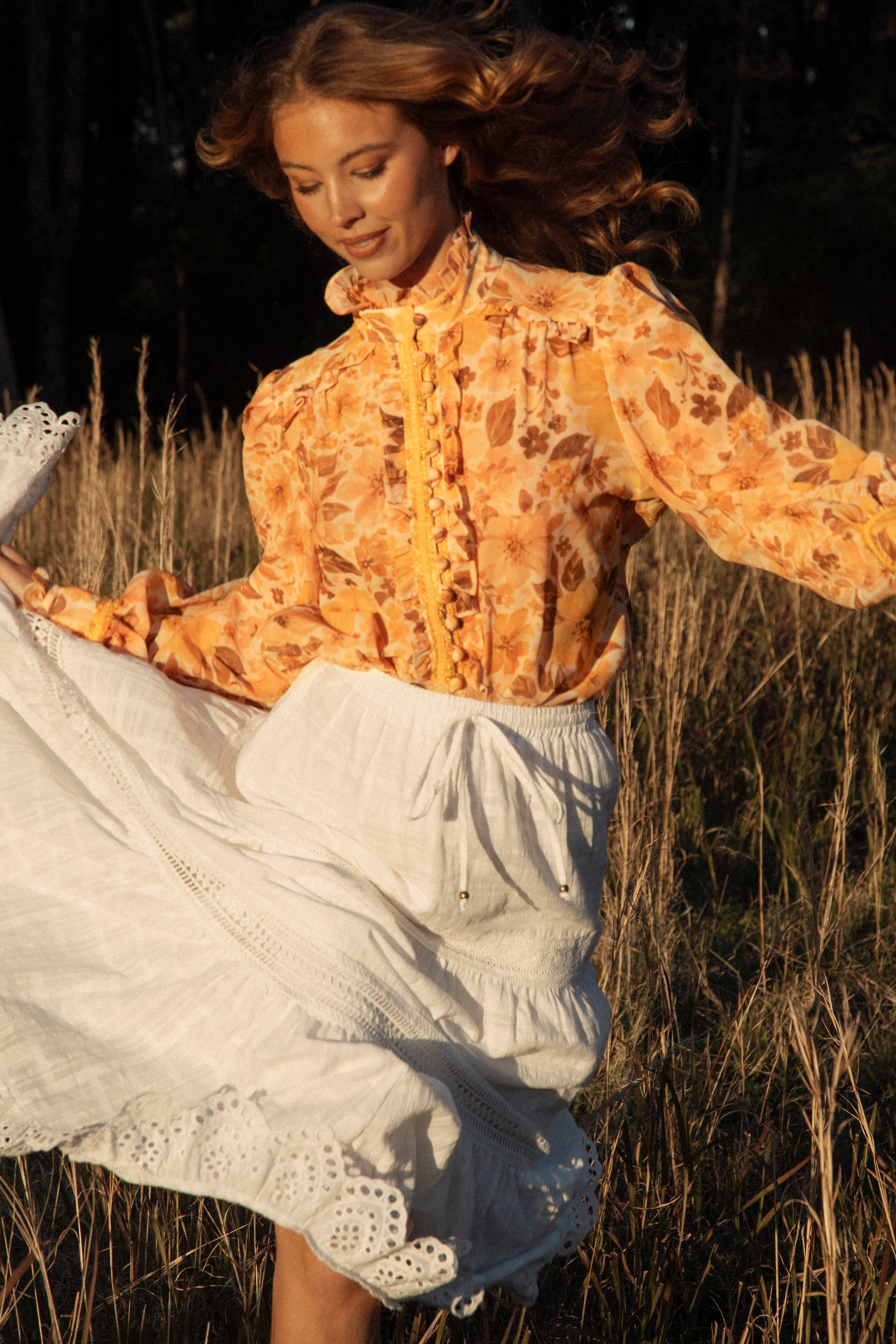 Saffron Dreams Blouse featuring high neck style, voluminous long sleeves in orange and brown pattern