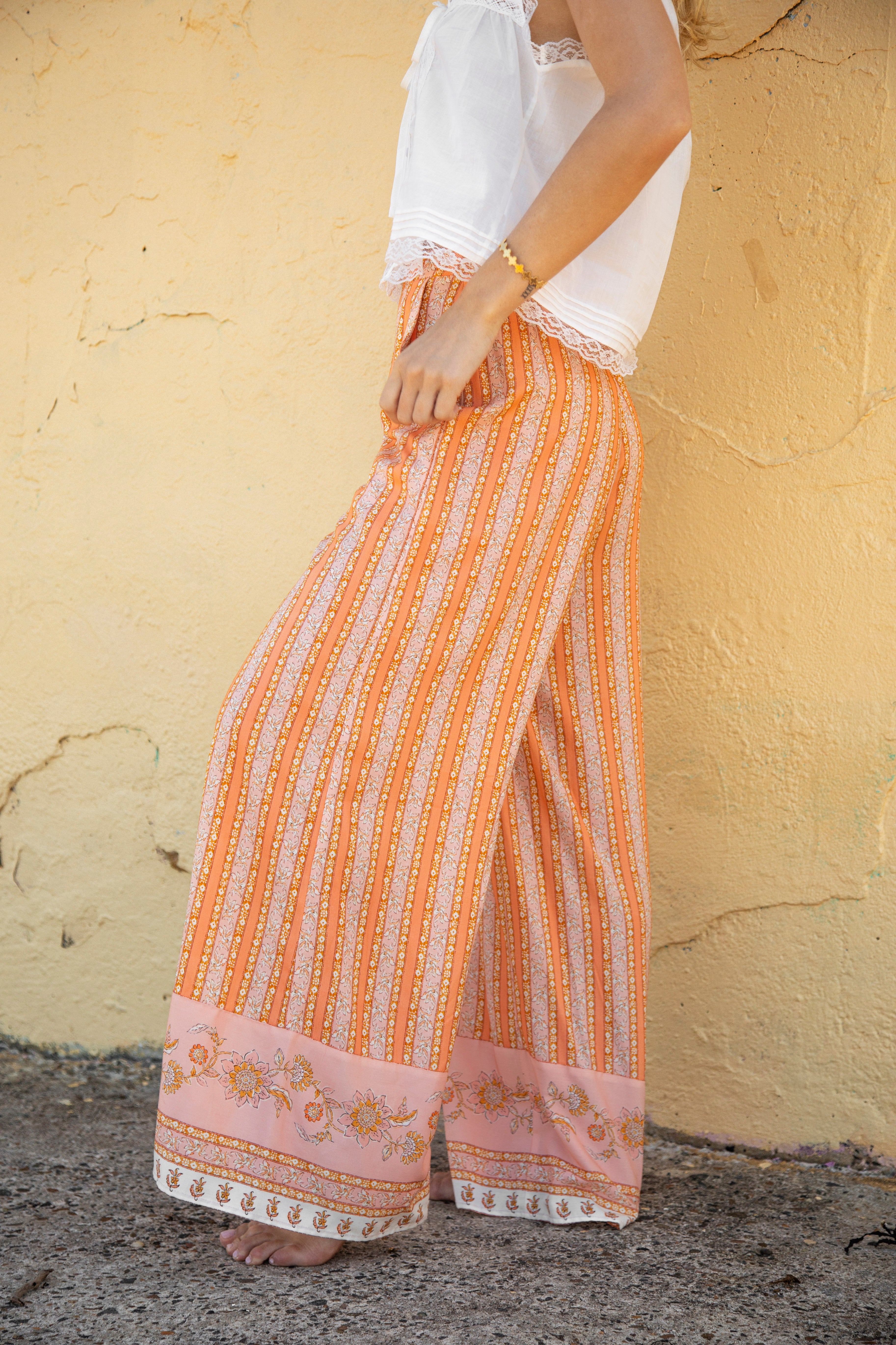 Sandi Stripe Pant Goldie Side view showcasing boho stripe pattern and contrasting detail on hem