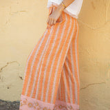Sandi Stripe Pant Goldie Side view showcasing boho stripe pattern and contrasting detail on hem