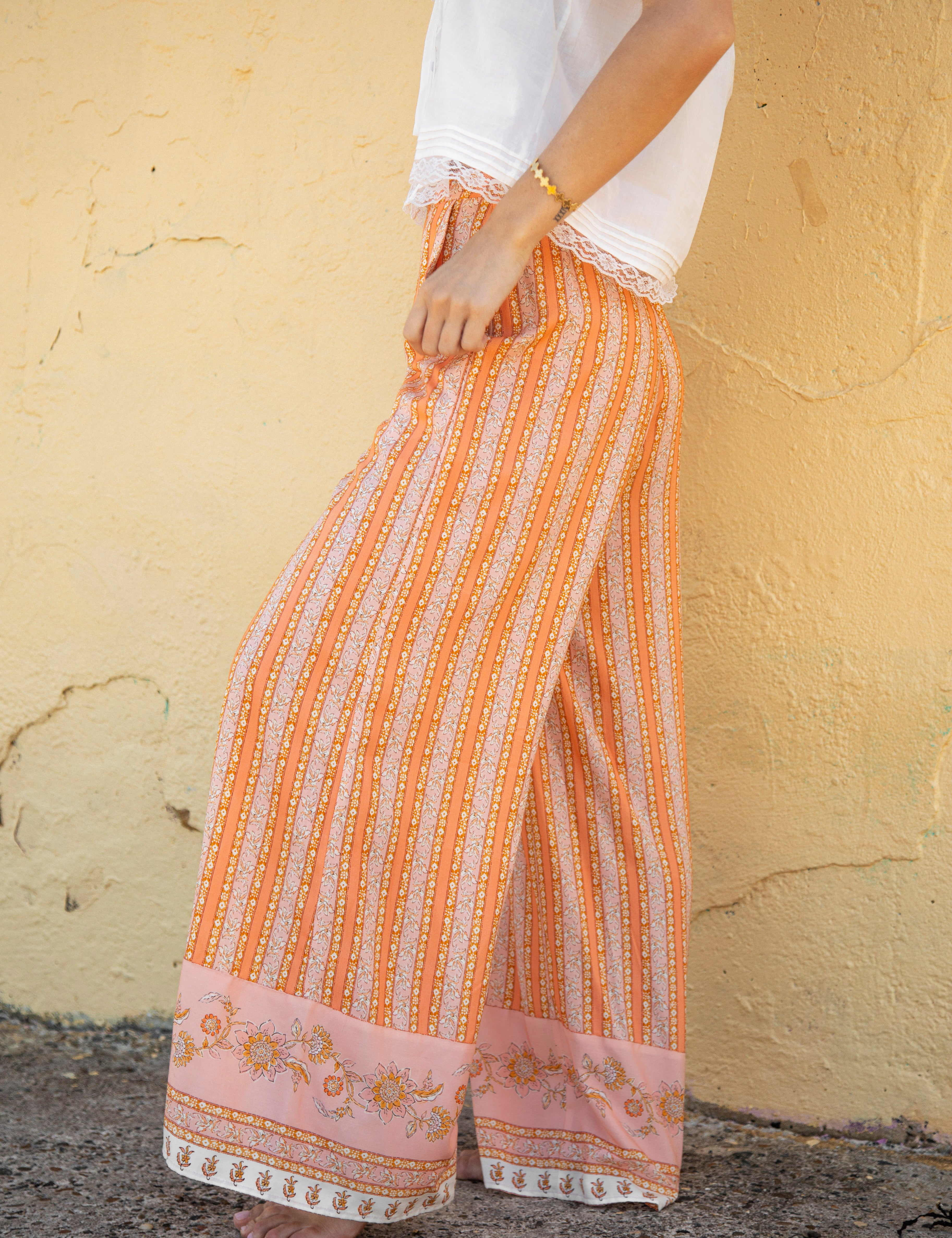 Sandi Stripe Pant Goldie Side view showcasing boho stripe pattern and contrasting detail on hem