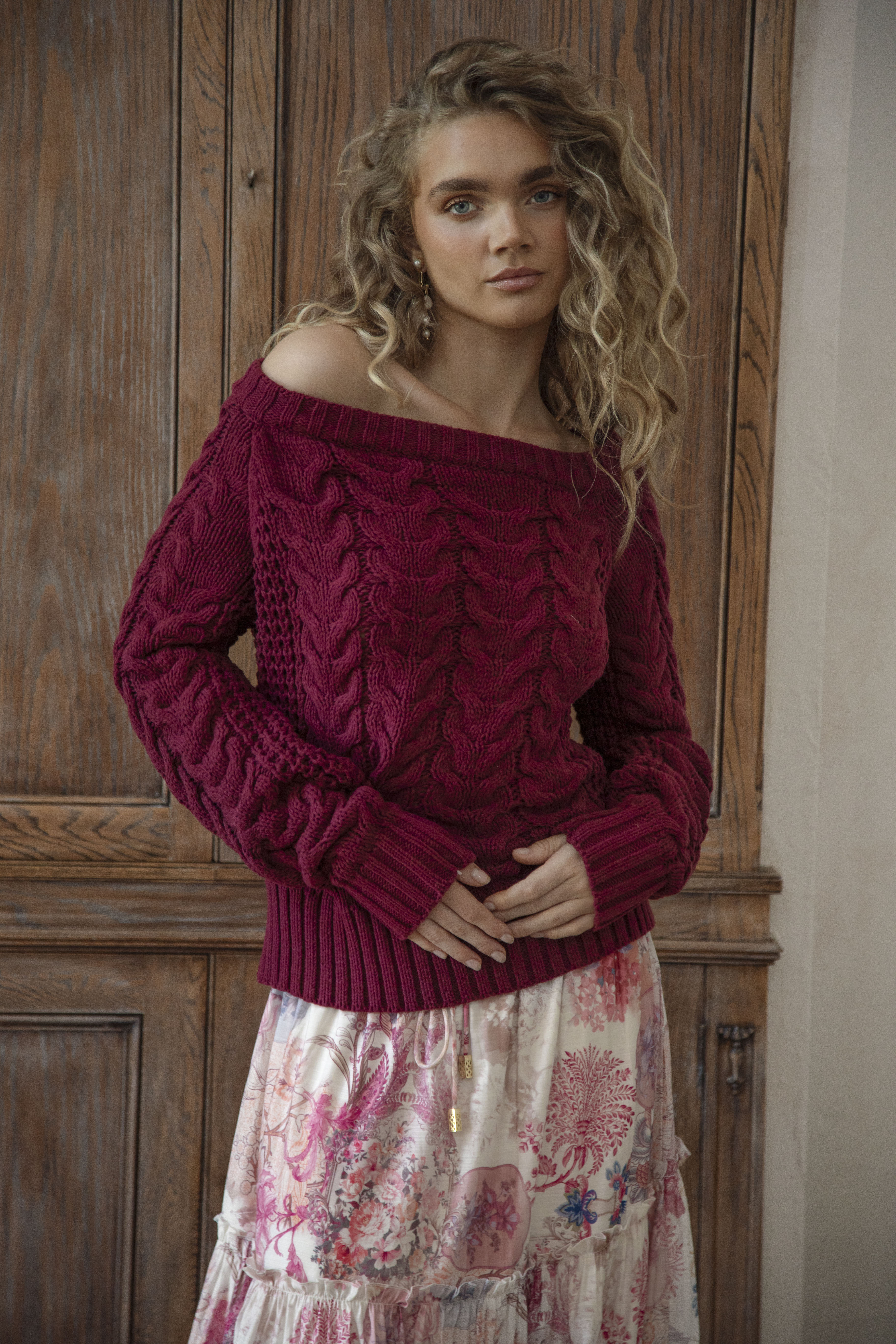 Seraphine Off Shoulder Knit Wine is a soft, cosy sweater featuring textured knit and off the shoulder style.