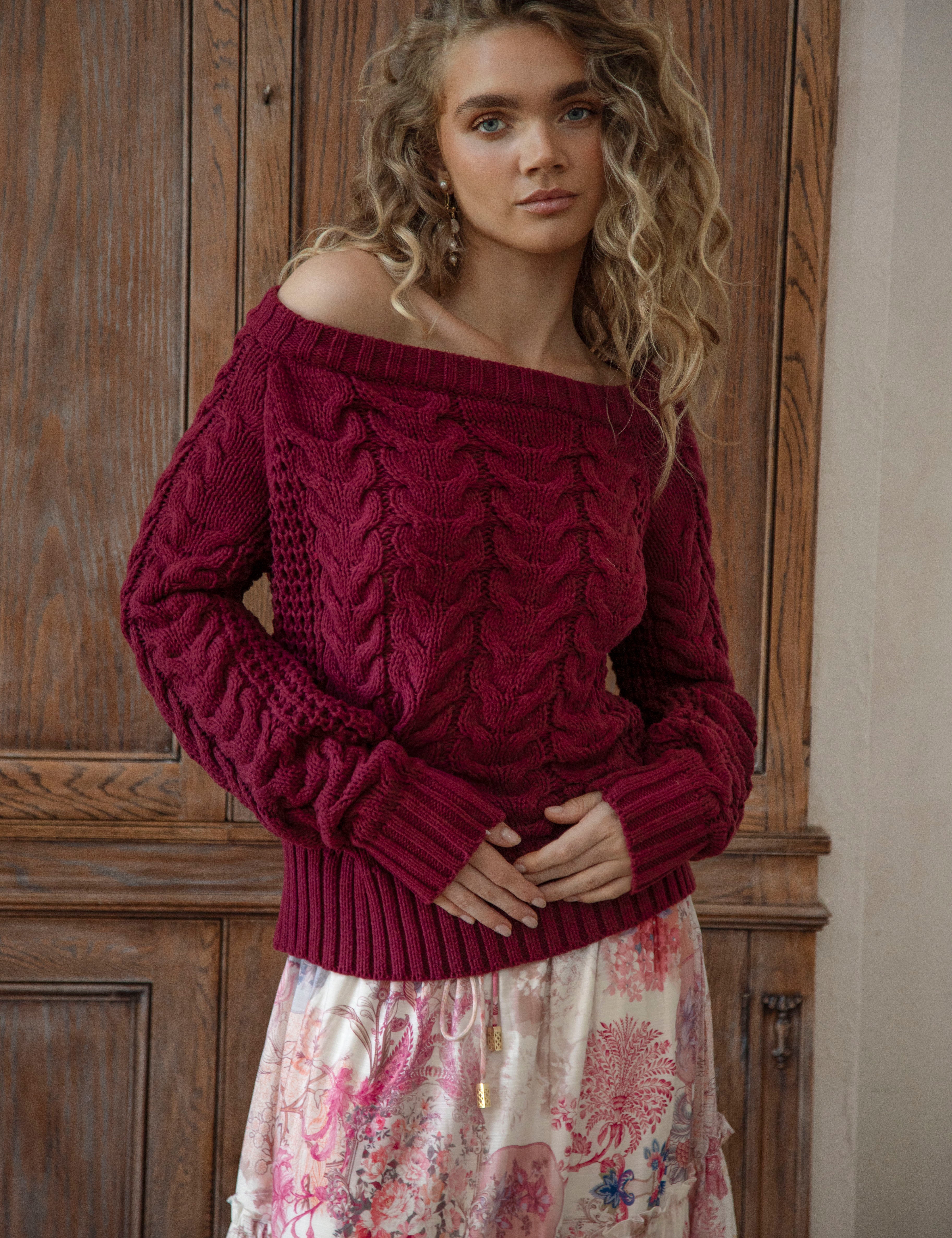Seraphine Off Shoulder Knit Wine is a soft, cosy sweater featuring textured knit and off the shoulder style.
