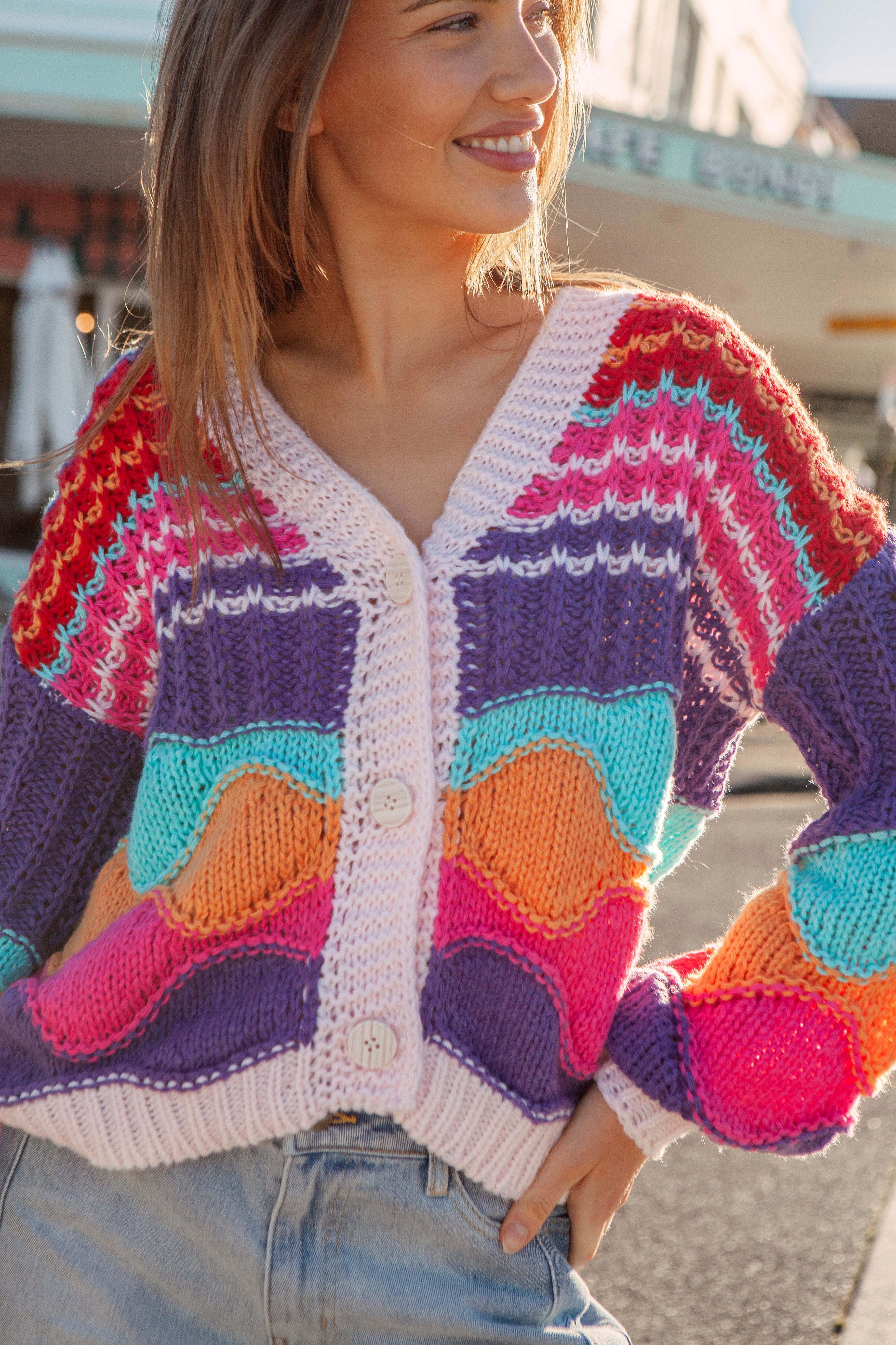 Sherbet Skies Cardigan - multi-coloured knit in shades of purple, pink, orange, red, blue and white.