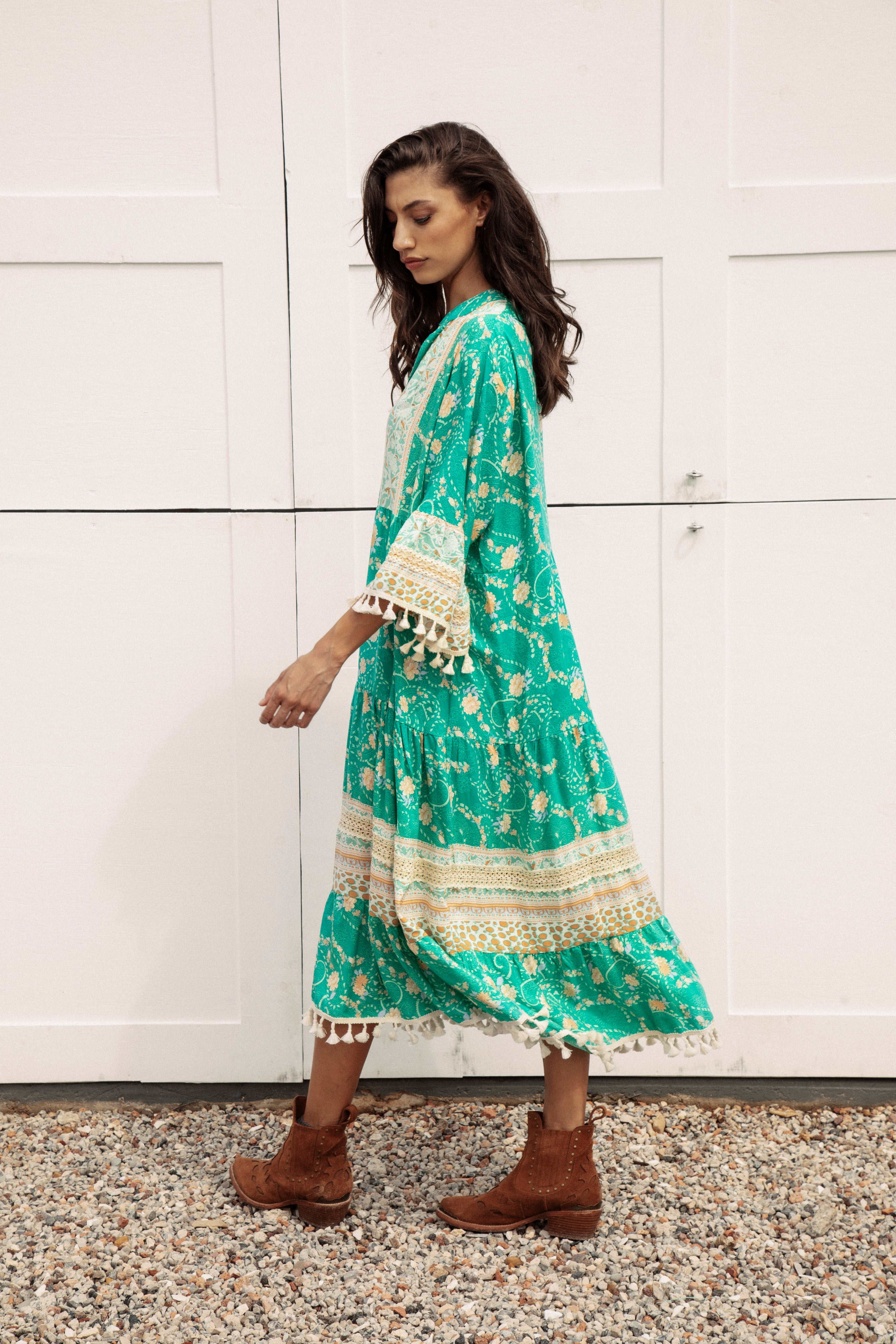 Soiree Midi Jewel. Classic Boho style dress in stunning green colourway with contrasting trim and pom pom detail.