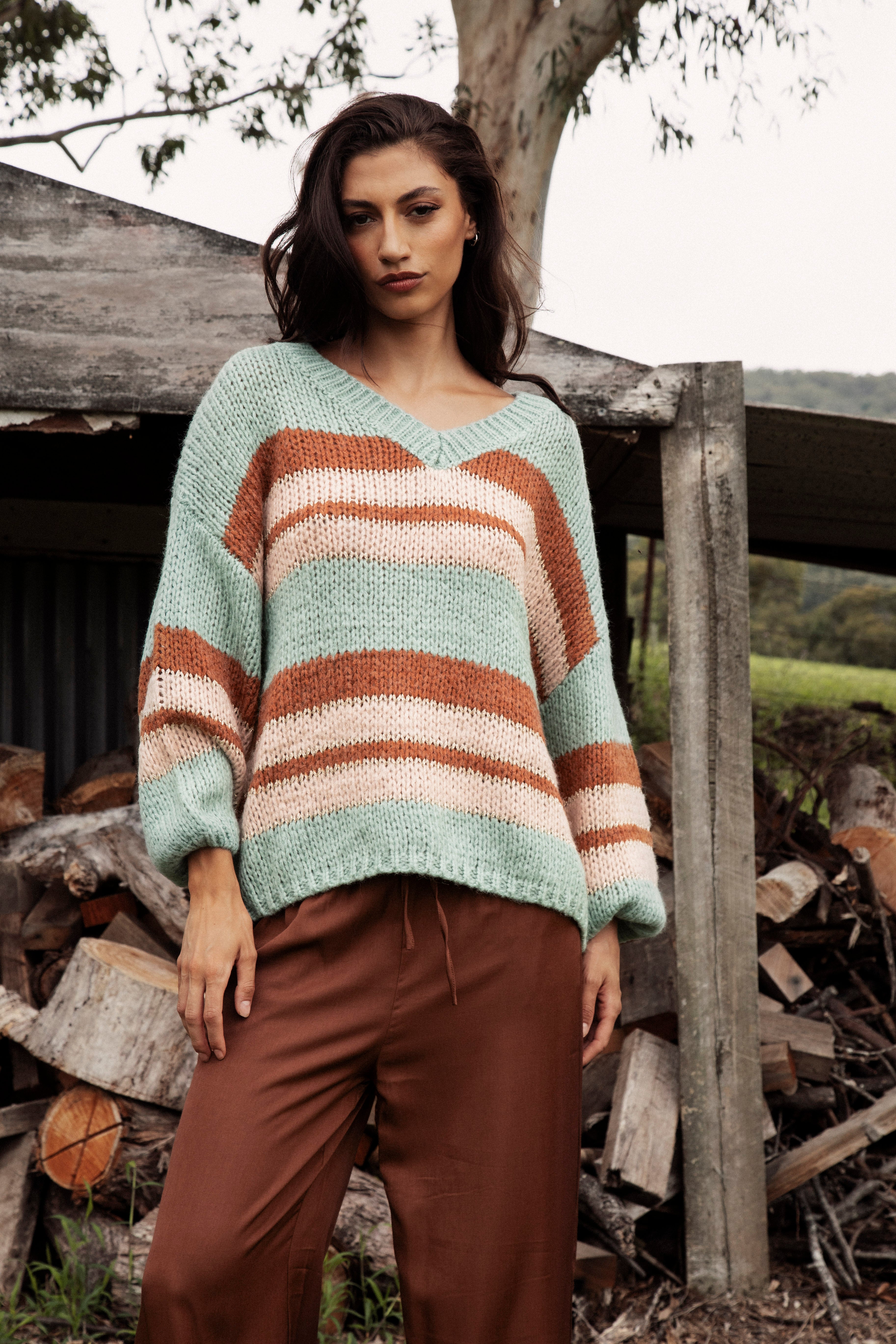 Soren V Neck Jumper Pistachio is a soft easy to wear sweater featuring striped pattern in shades of blue, cream and brown.