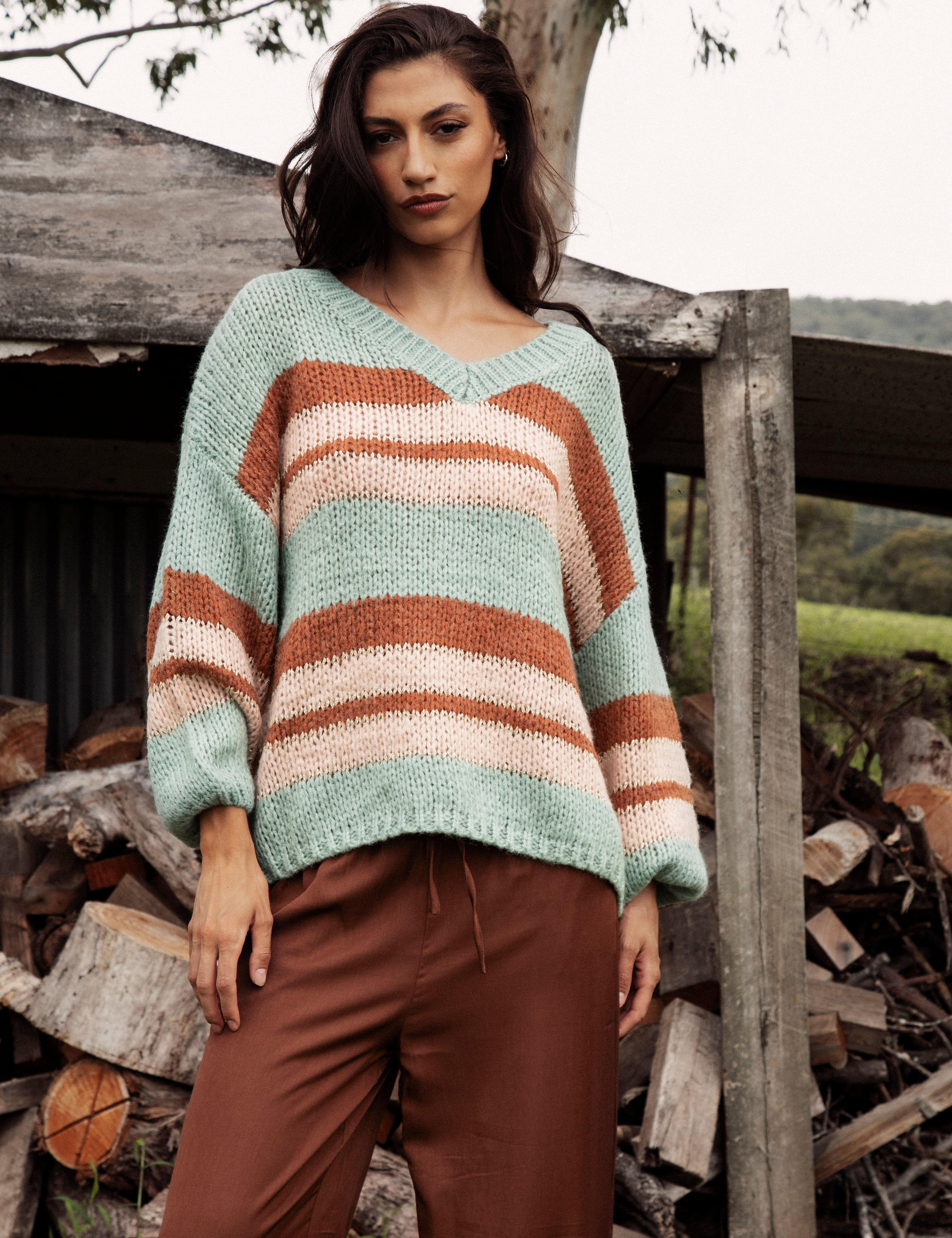 Soren V Neck Jumper Pistachio is a soft easy to wear sweater featuring striped pattern in shades of blue, cream and brown.