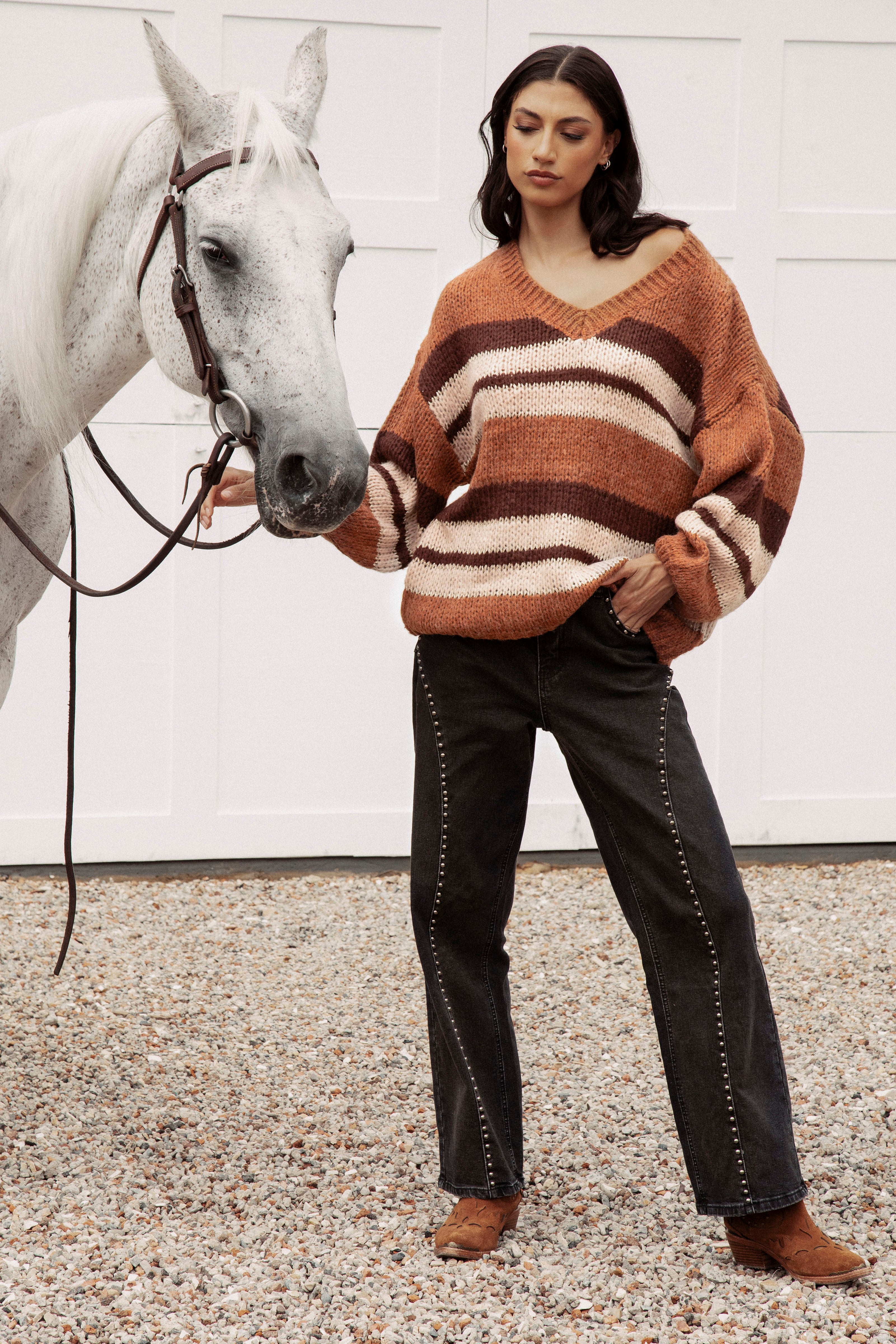 Soren V Neck Knit Rust is a striking sweater featuring striped pattern, v neckline and slouchy style.