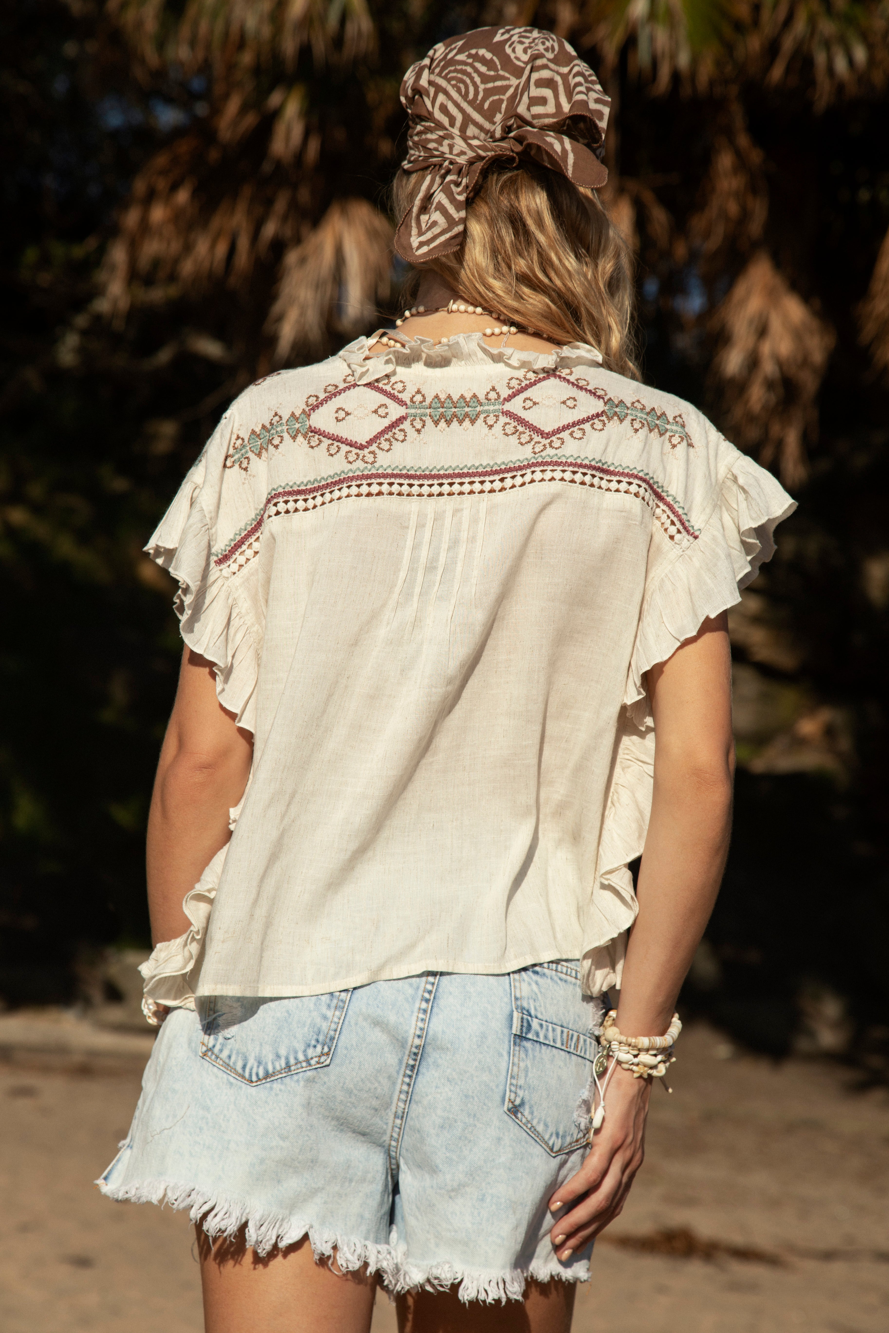 Stella Tie Top Shell Rear View showcasing tribal pattern embroidery