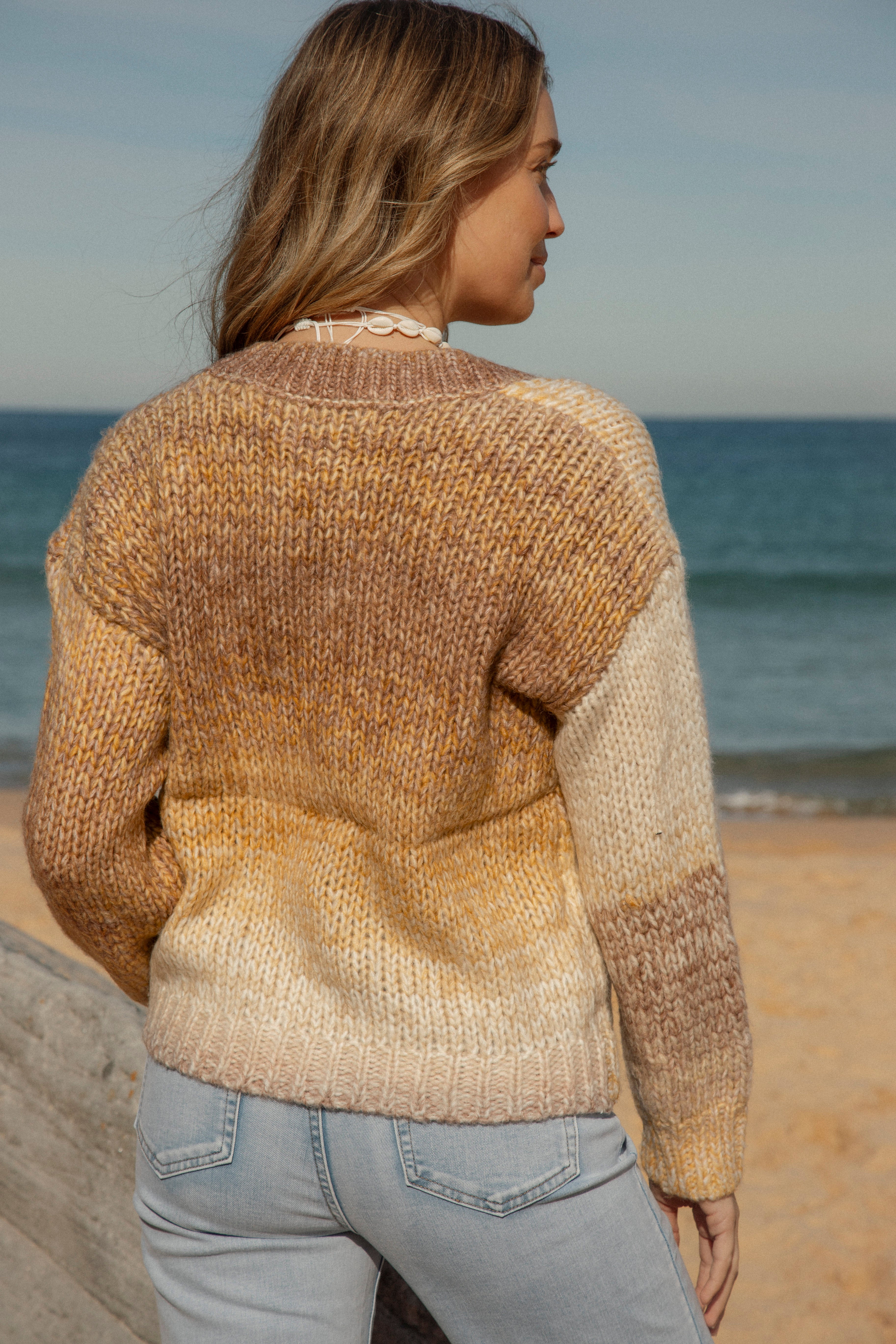 Sundancer Knit Golden Hour features shades of brown and cream. Rear View.