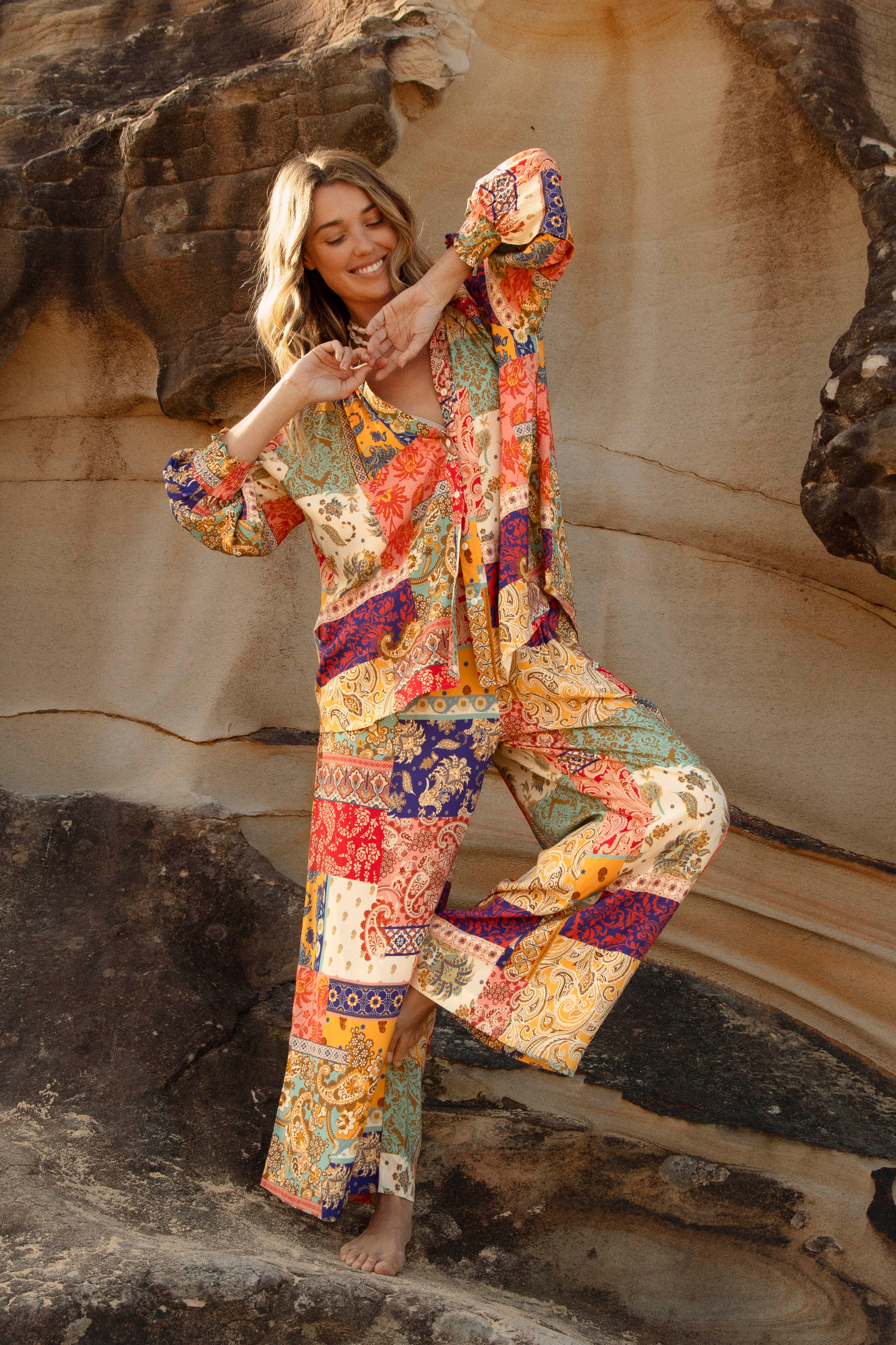 Sunseeker Blouse worn with matching pants. A vibrant patchwork patterned Boho inspired set.