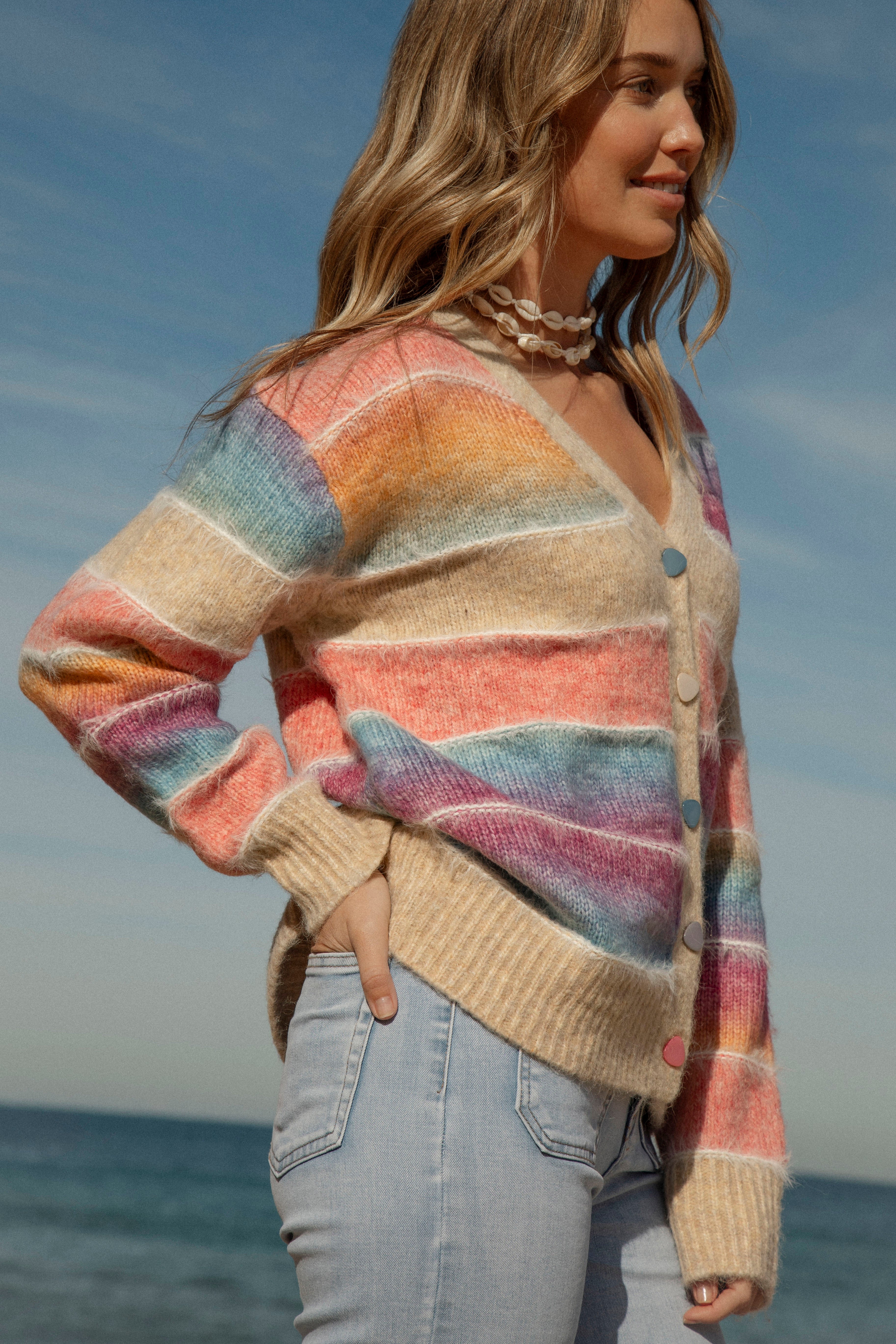 Sunshine State of Mind Cardigan featured rainbow coloured ombre stripes and button up style. Side View.