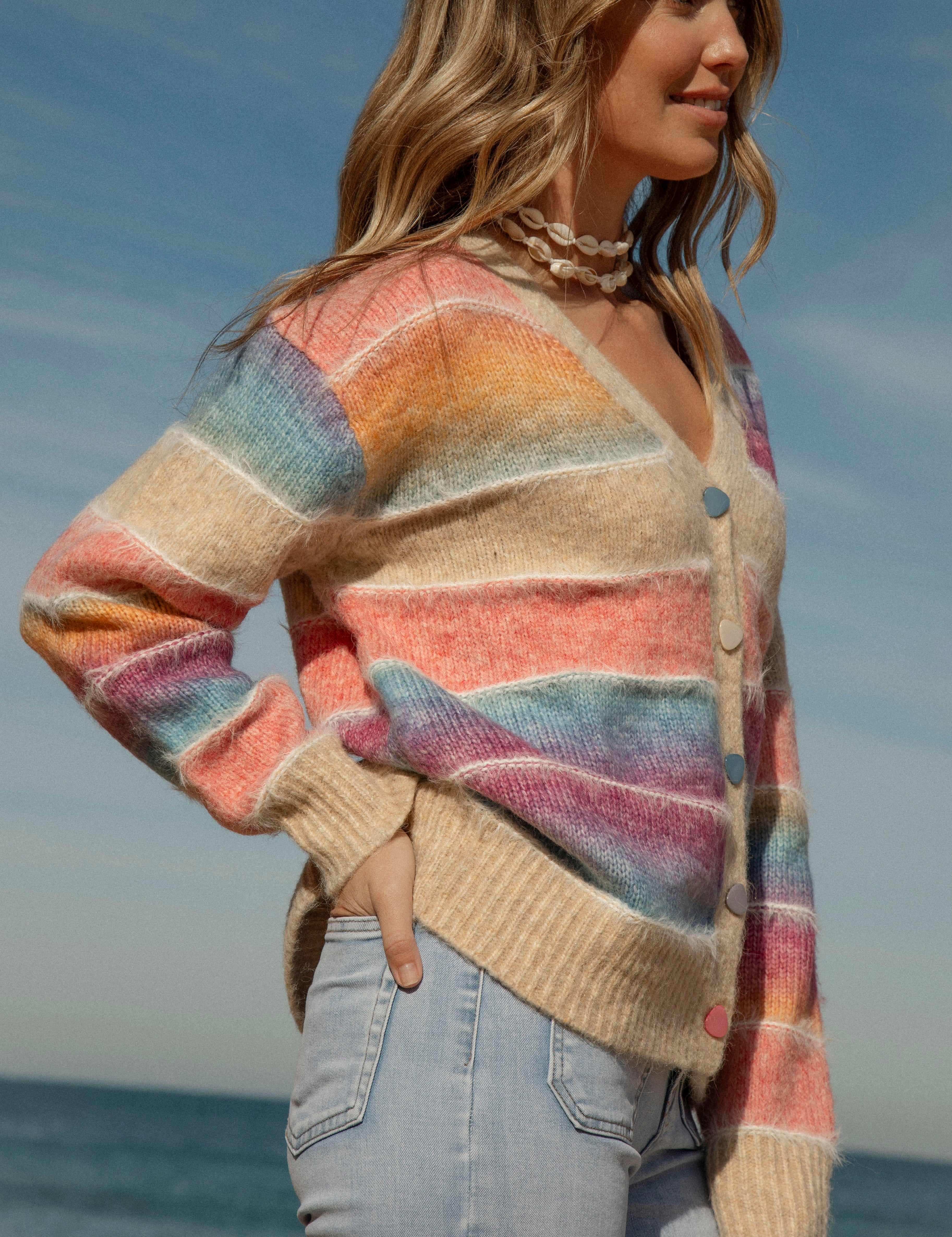 Sunshine State of Mind Cardigan featured rainbow coloured ombre stripes and button up style. Side View.