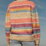 Sunshine State of Mind Cardigan is a Boho style rainbow striped cardigan. Rear View.