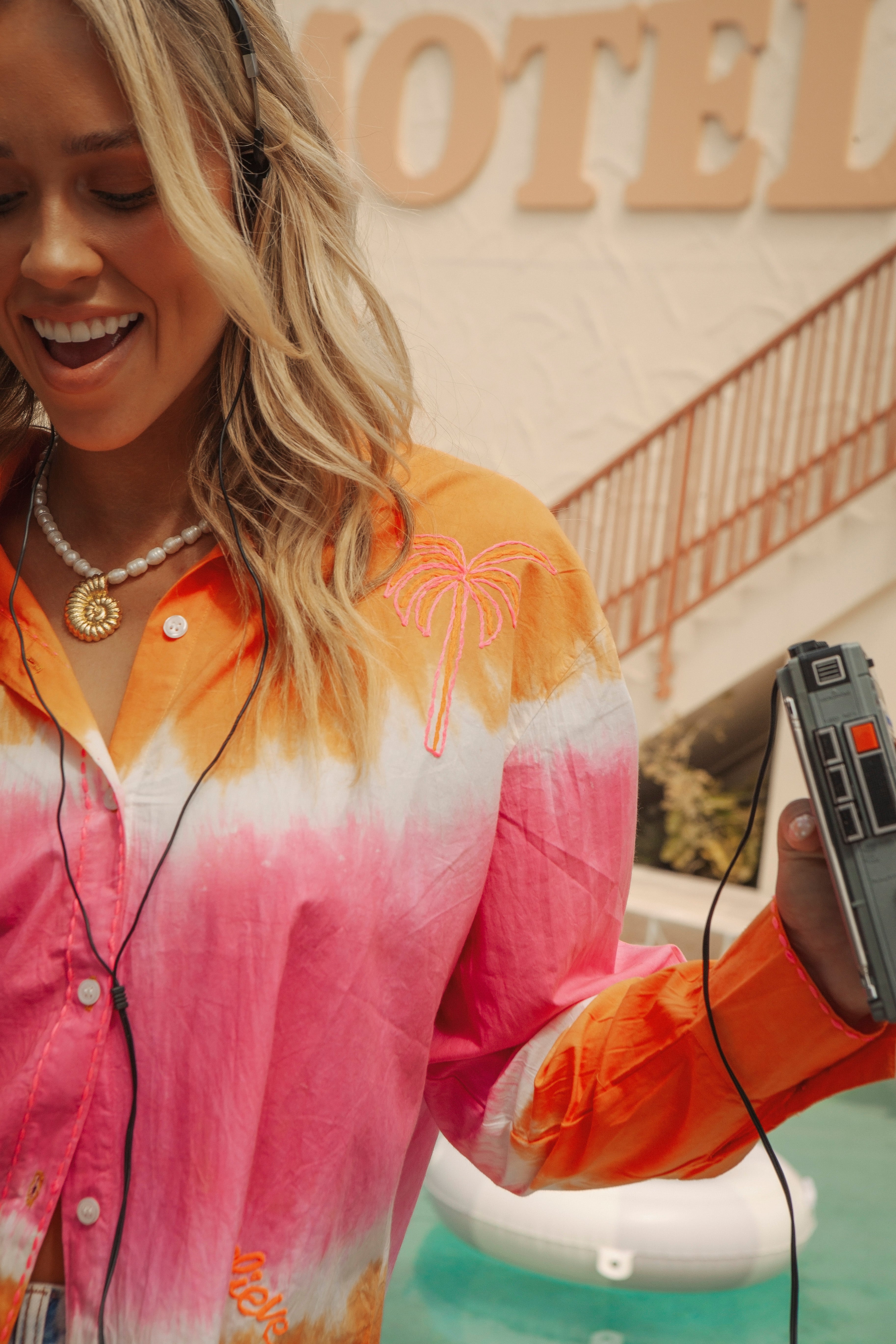 Tequila Sunrise Shirt showcasing embroidered palm tree motif